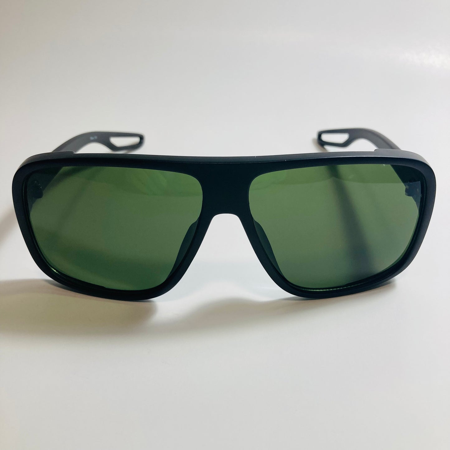 mens and womens black square sunglasses with green lenses