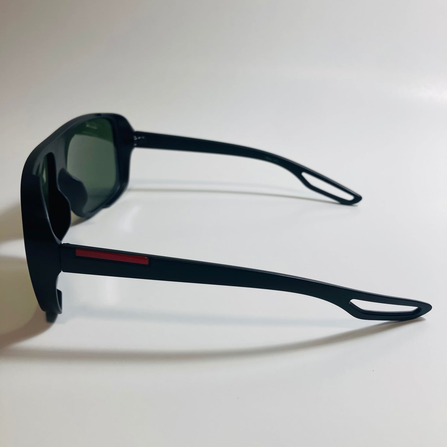 mens and womens black square sunglasses with green lenses