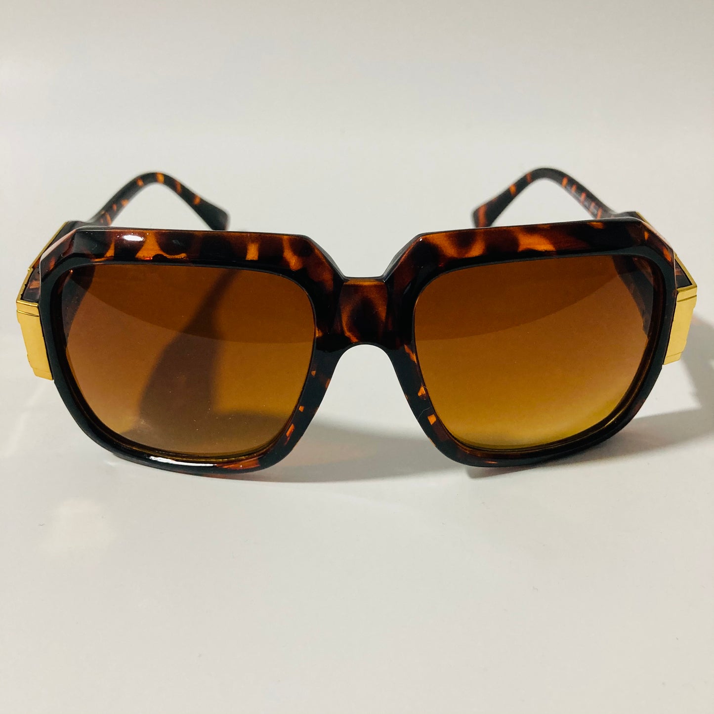 mens and womens brown and gold gazelle sunglasses