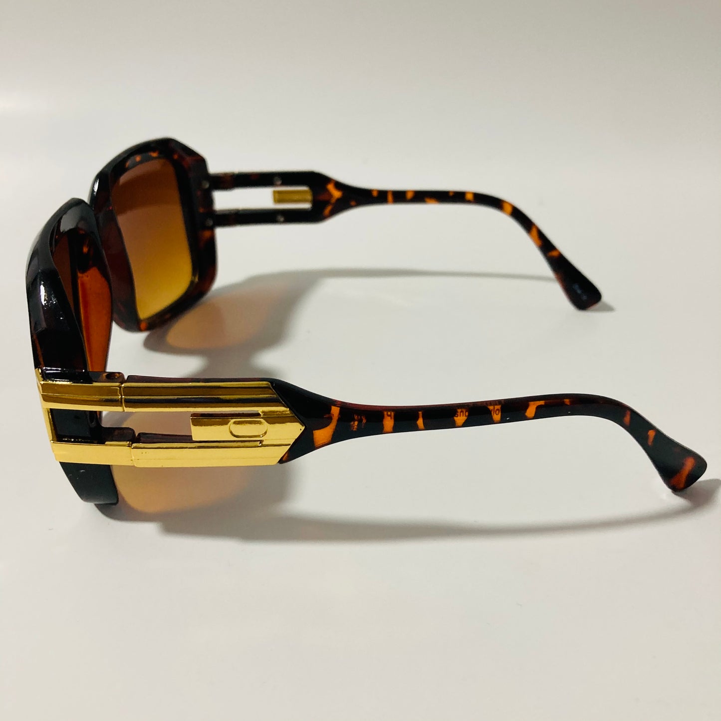 mens and womens brown and gold gazelle sunglasses