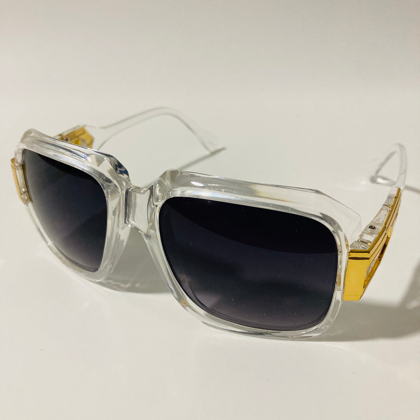 mens and womens clear black and gold gazelle sunglasses