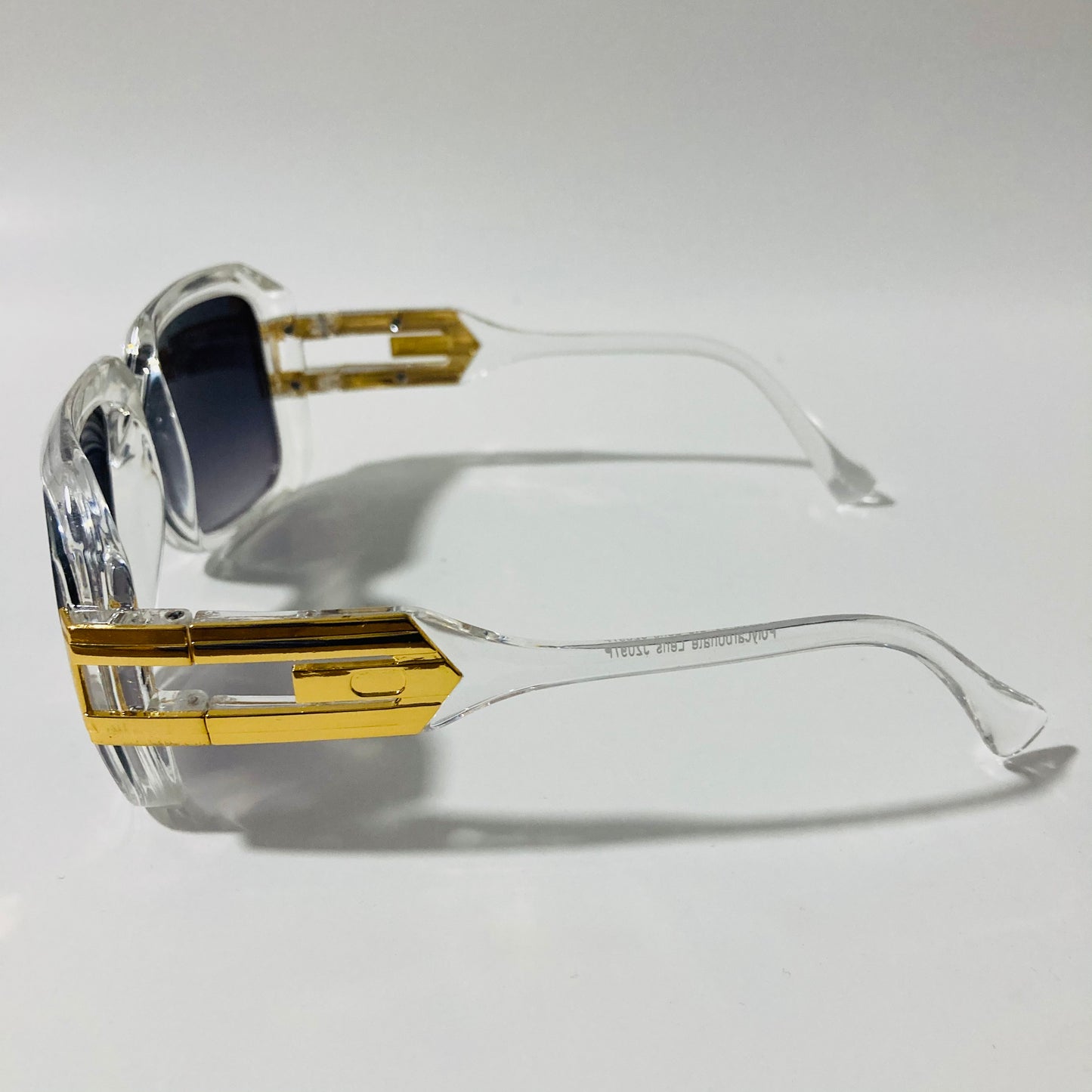 mens and womens clear black and gold gazelle sunglasses