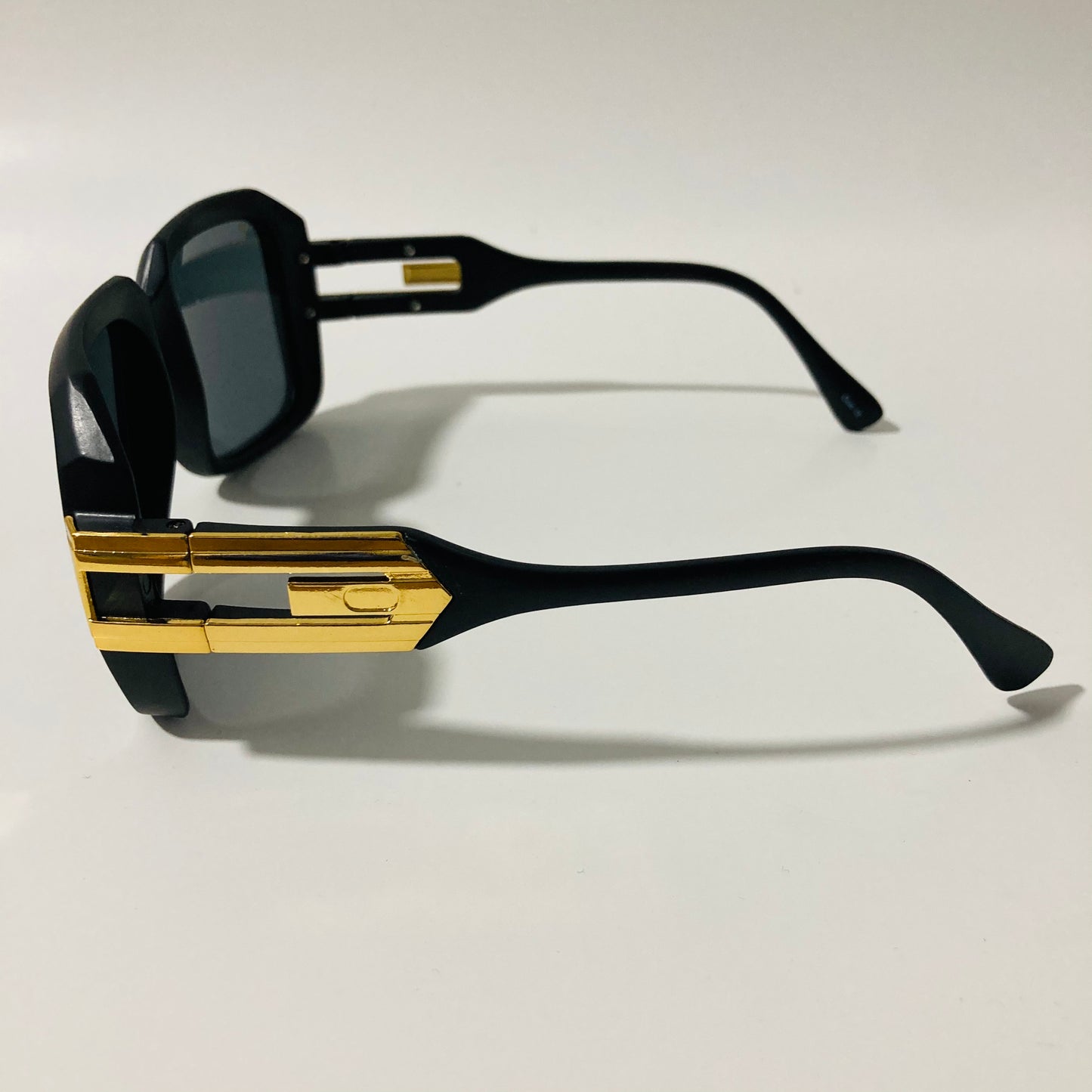 mens and womens black and gold gazelle sunglasses