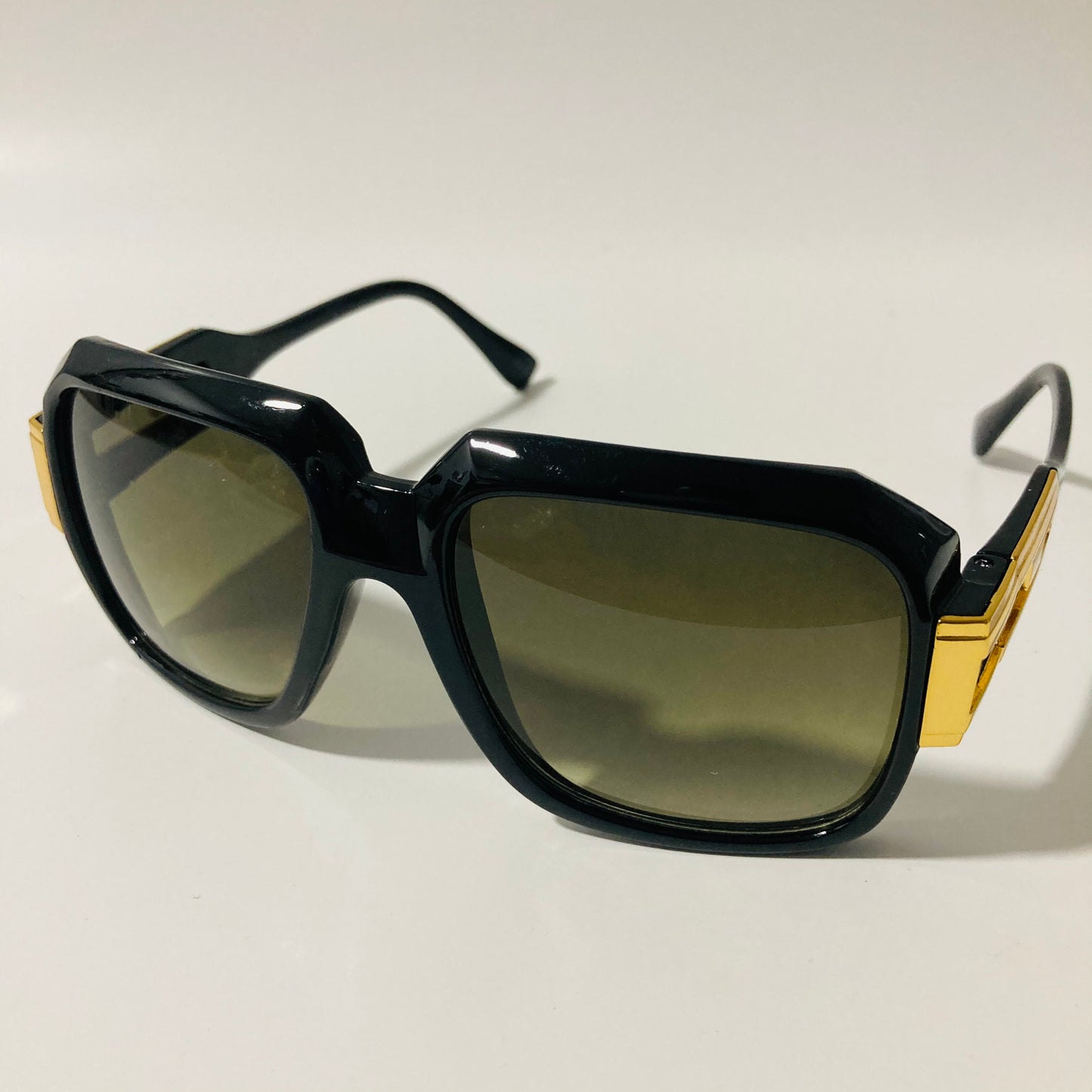 mens and womens black green and gold gazelle sunglasses