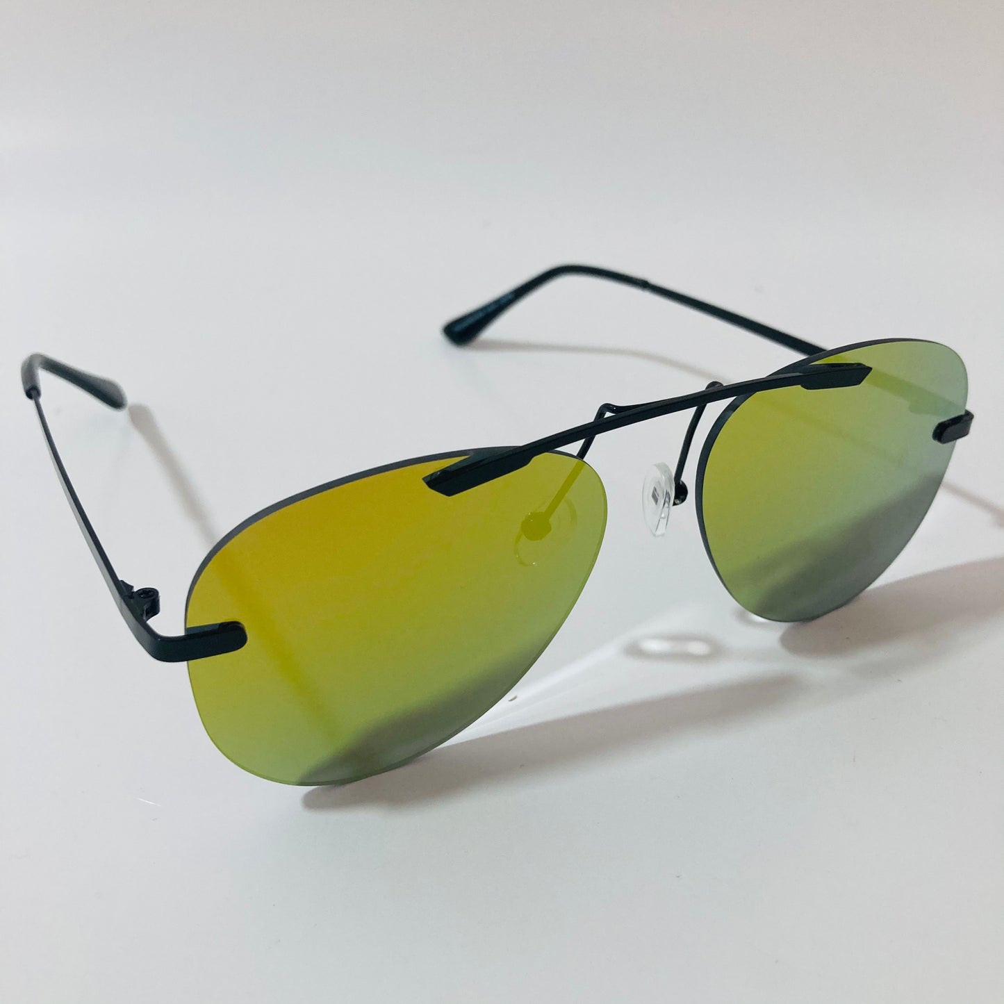 black rimless aviator sunglasses with yellow mirror lenses