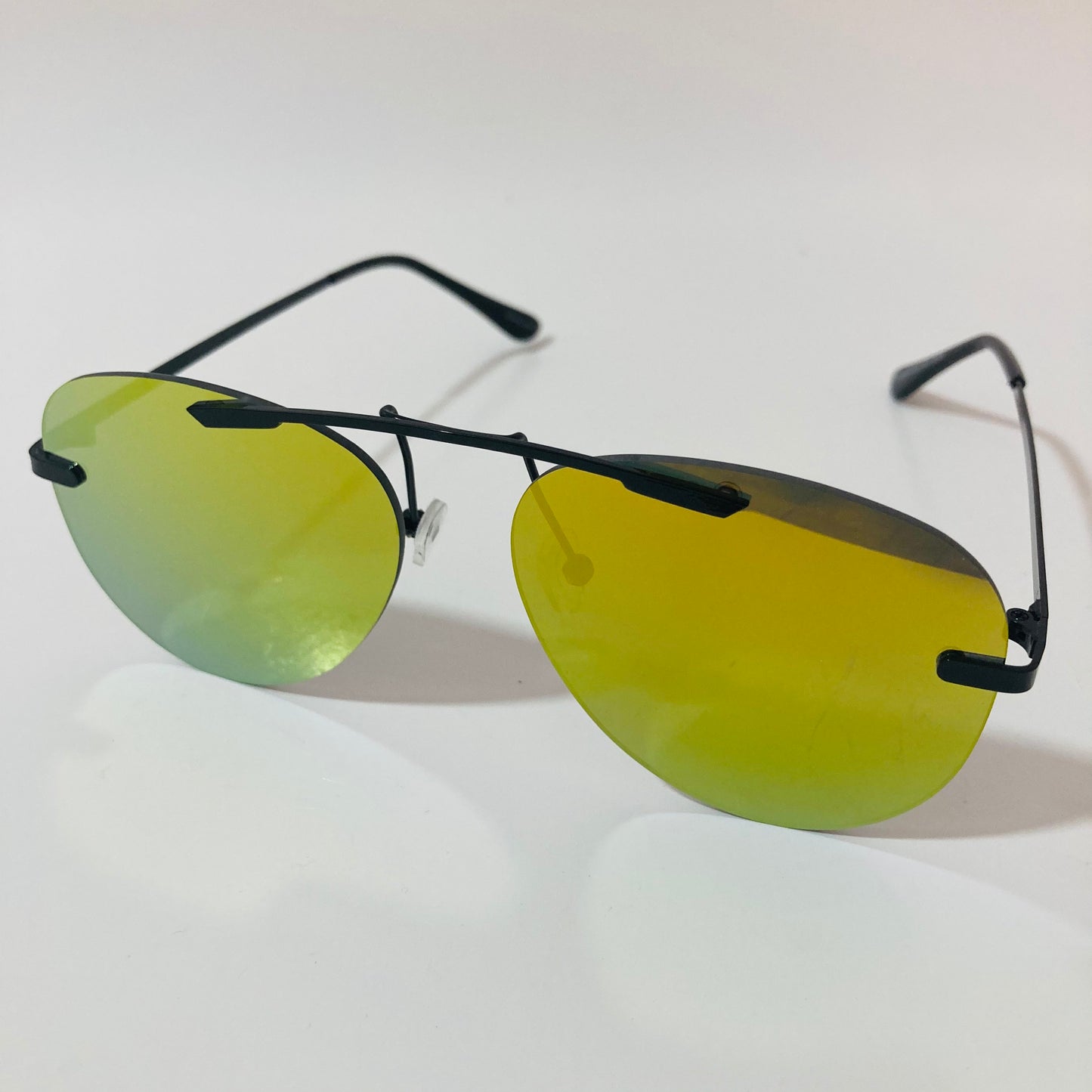 black rimless aviator sunglasses with yellow mirror lenses