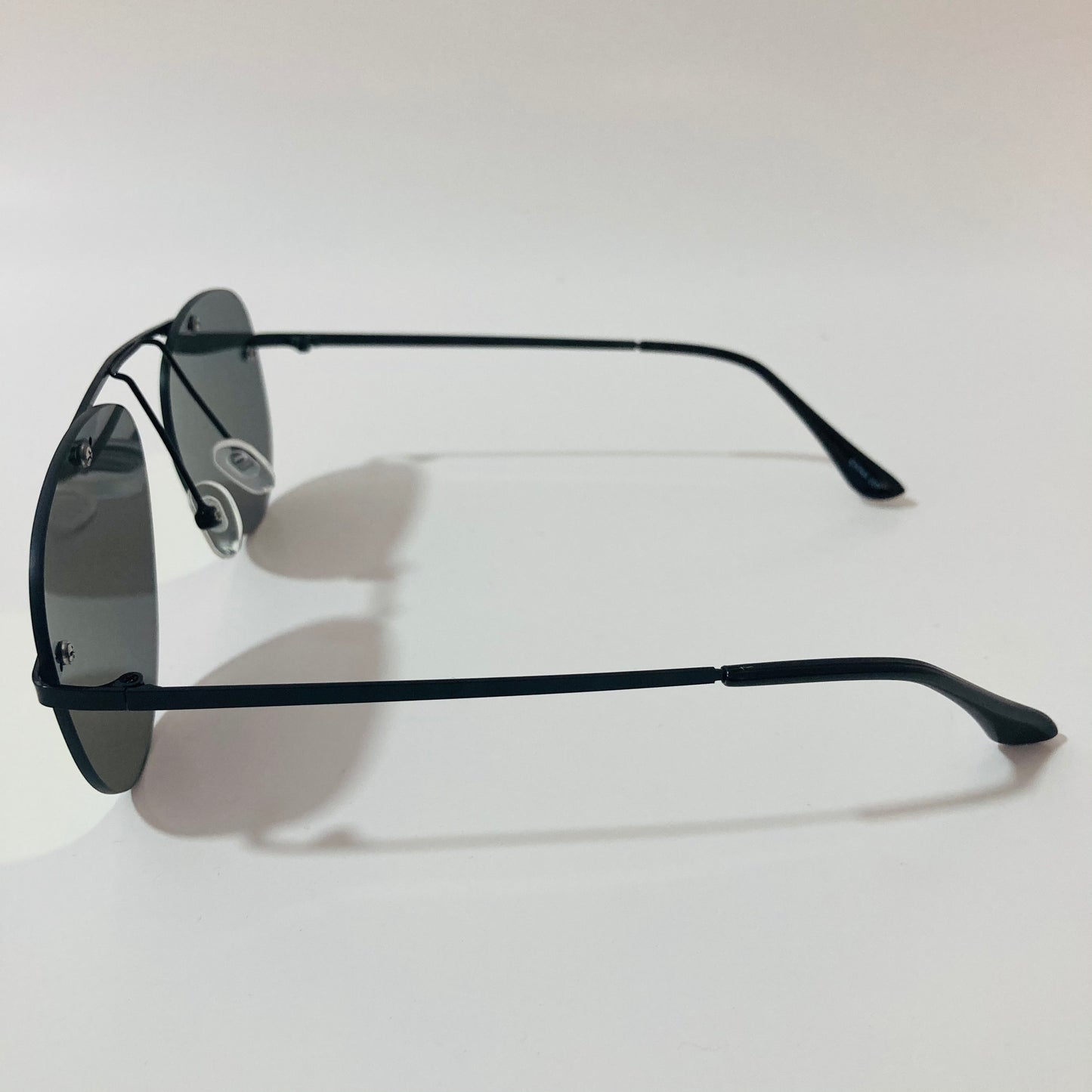 black rimless aviator sunglasses with yellow mirror lenses