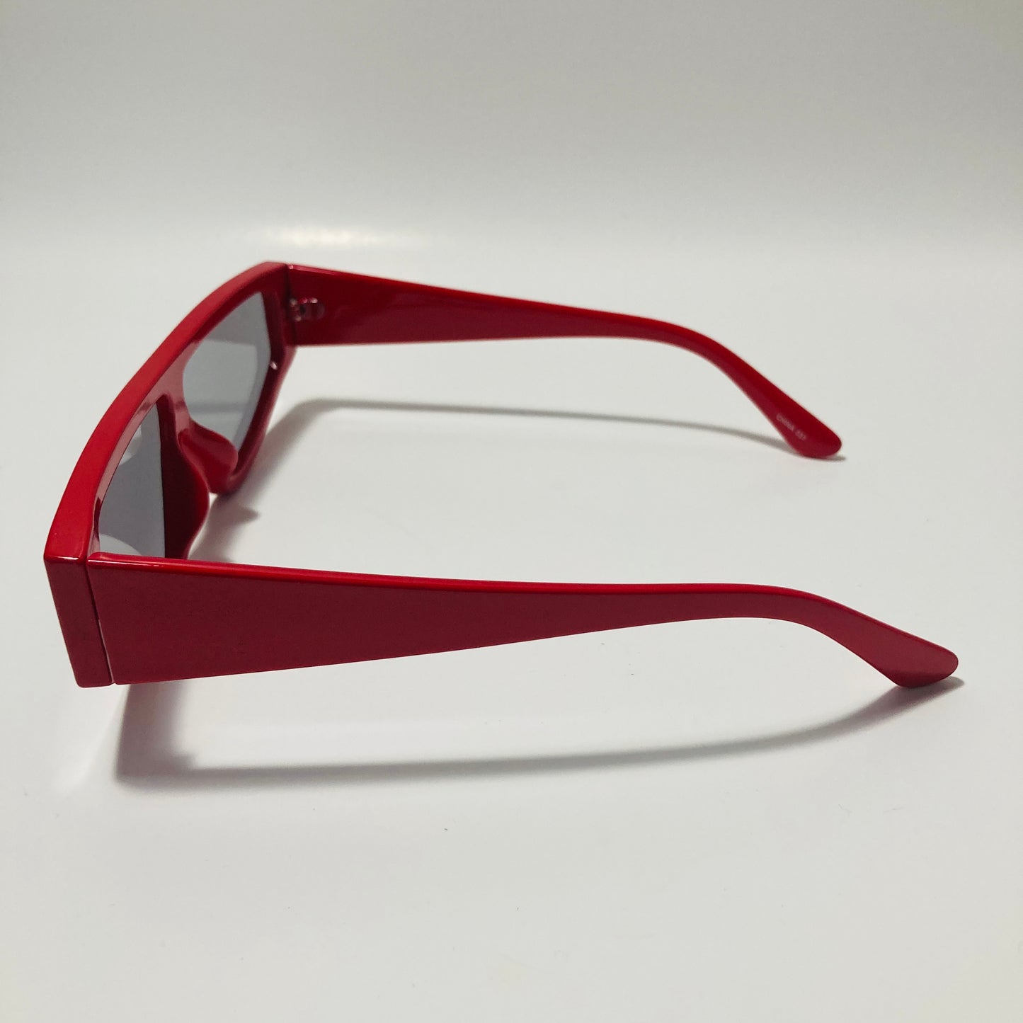 mens and womens red futuristic sunglasses with black lenses