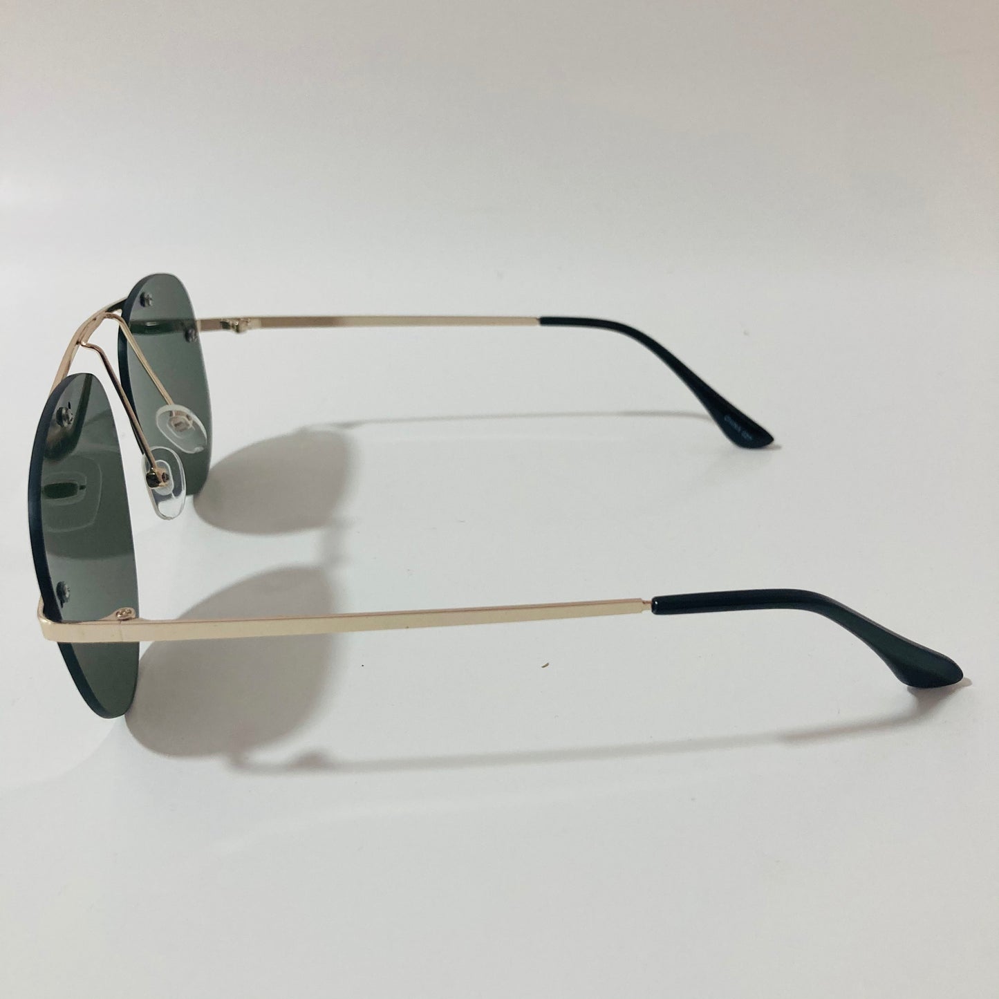 gold rimless aviator sunglasses with green mirror lenses