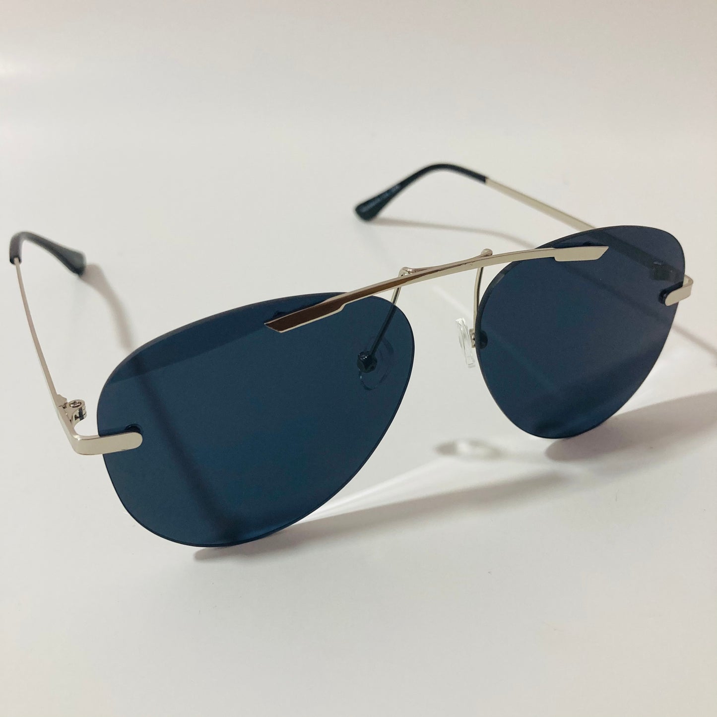 silver rimless aviator sunglasses with black mirror lenses