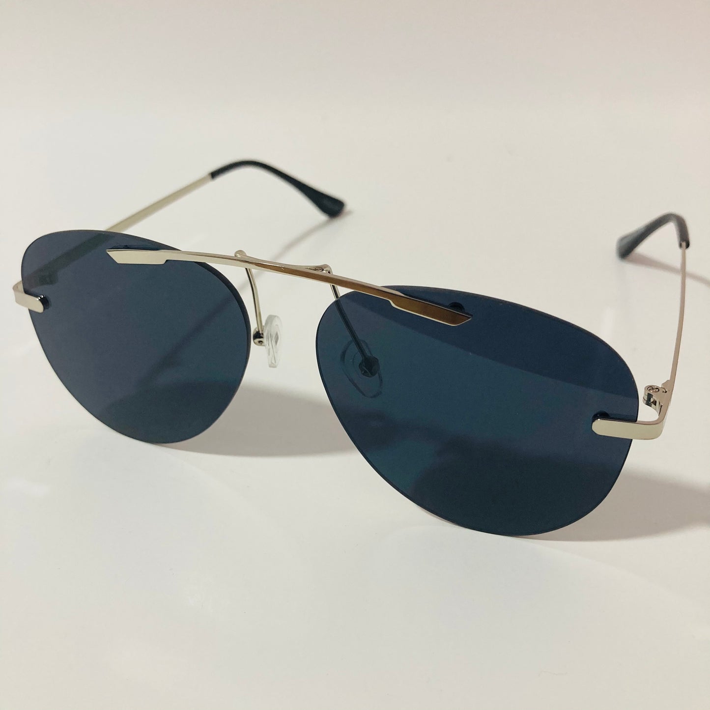 silver rimless aviator sunglasses with black mirror lenses