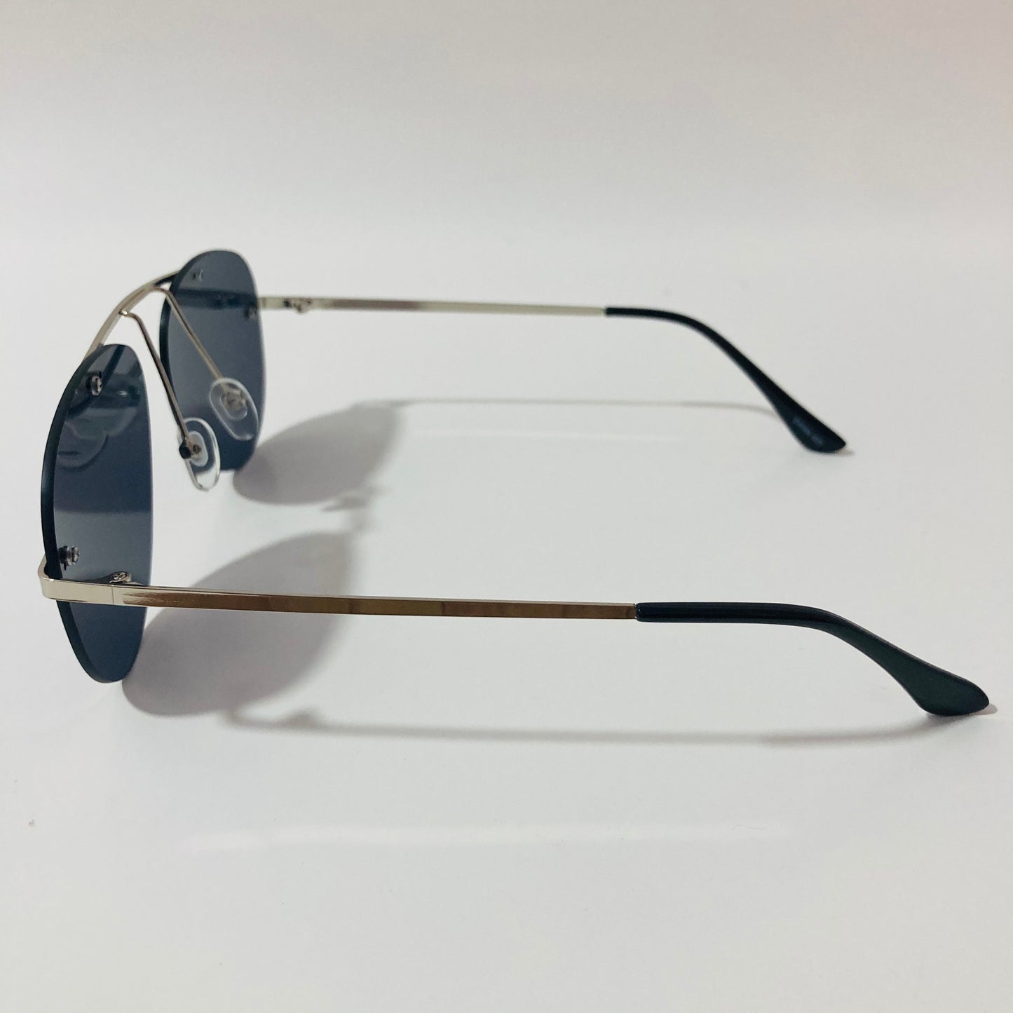 silver rimless aviator sunglasses with black mirror lenses