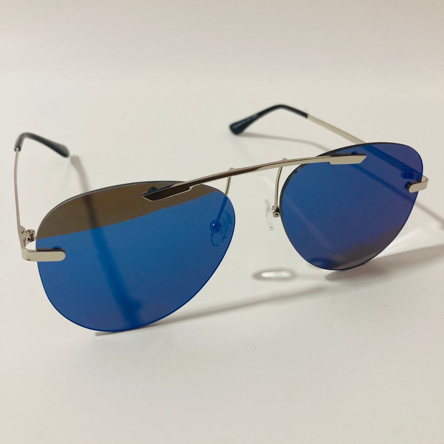 silver rimless aviator sunglasses with blue mirror lenses