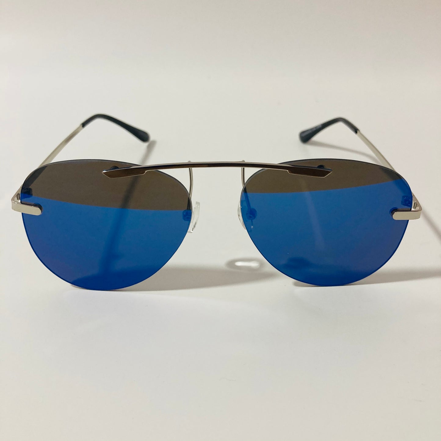 silver rimless aviator sunglasses with blue mirror lenses