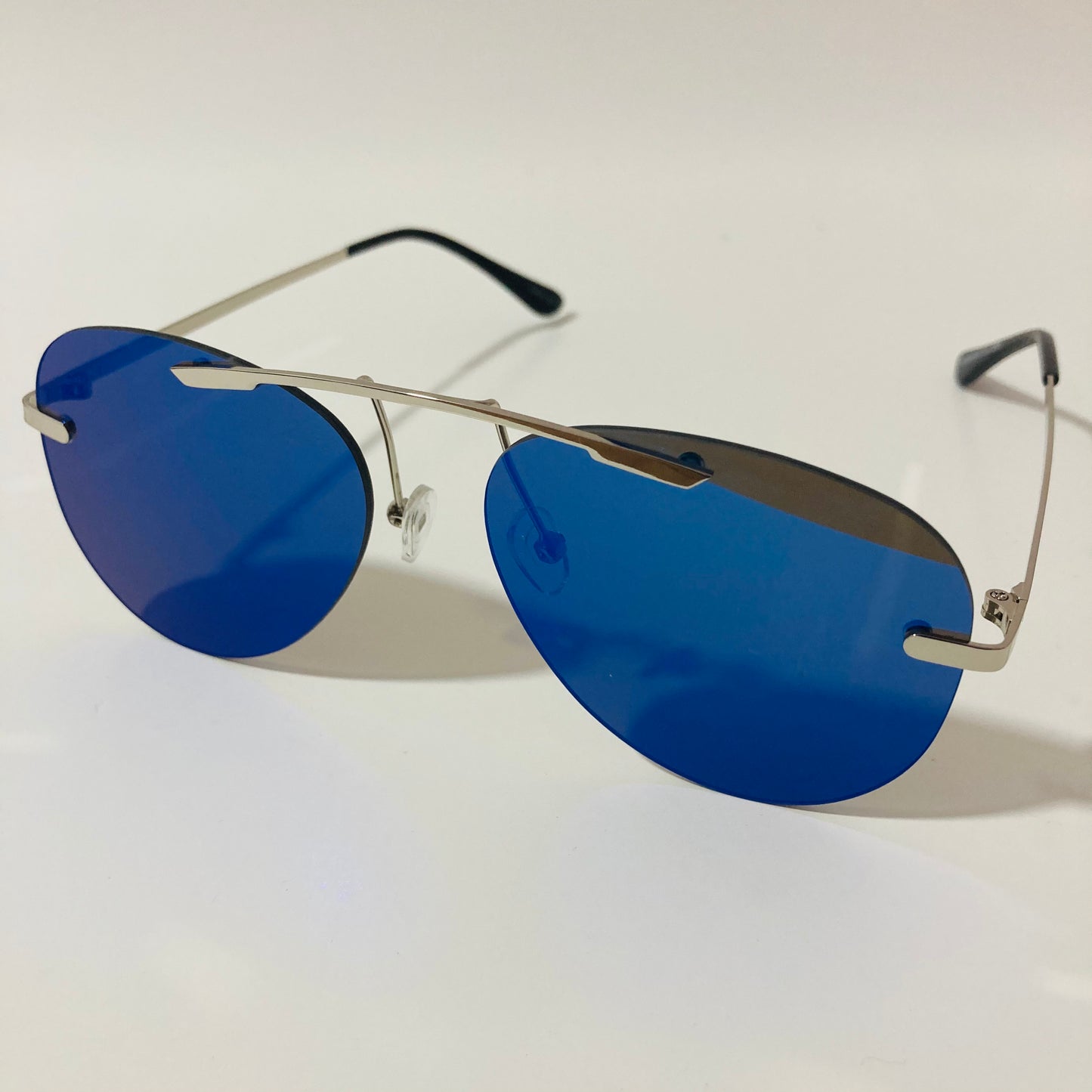 silver rimless aviator sunglasses with blue mirror lenses