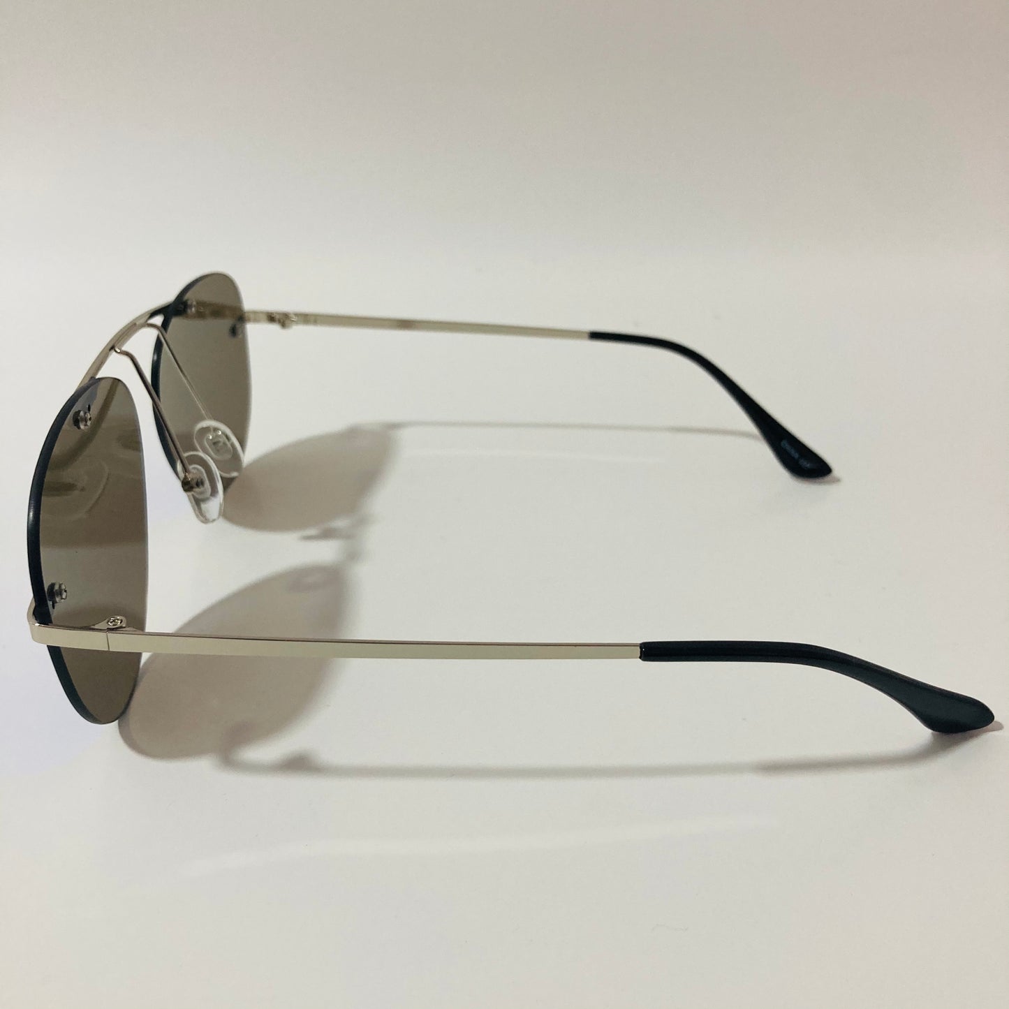 silver rimless aviator sunglasses with blue mirror lenses