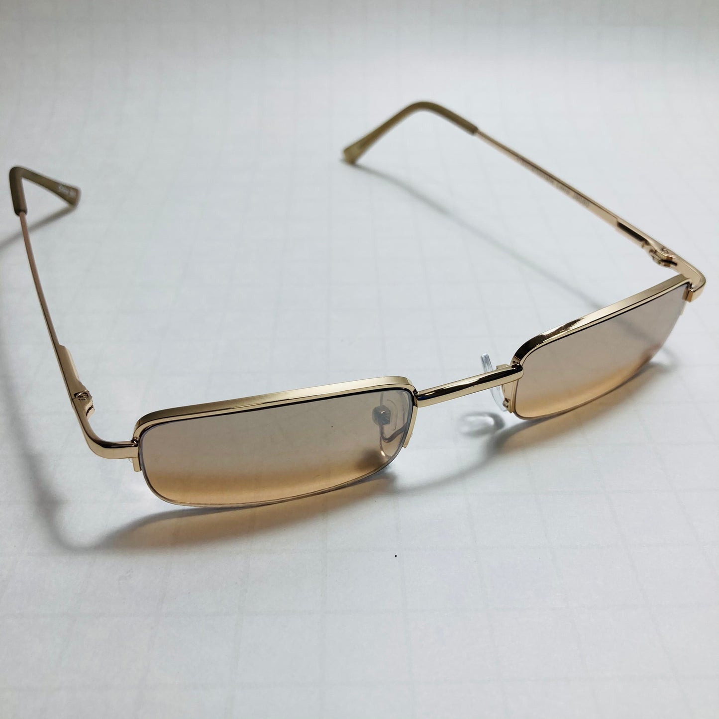 mens and womens brown and gold small square sunglasses