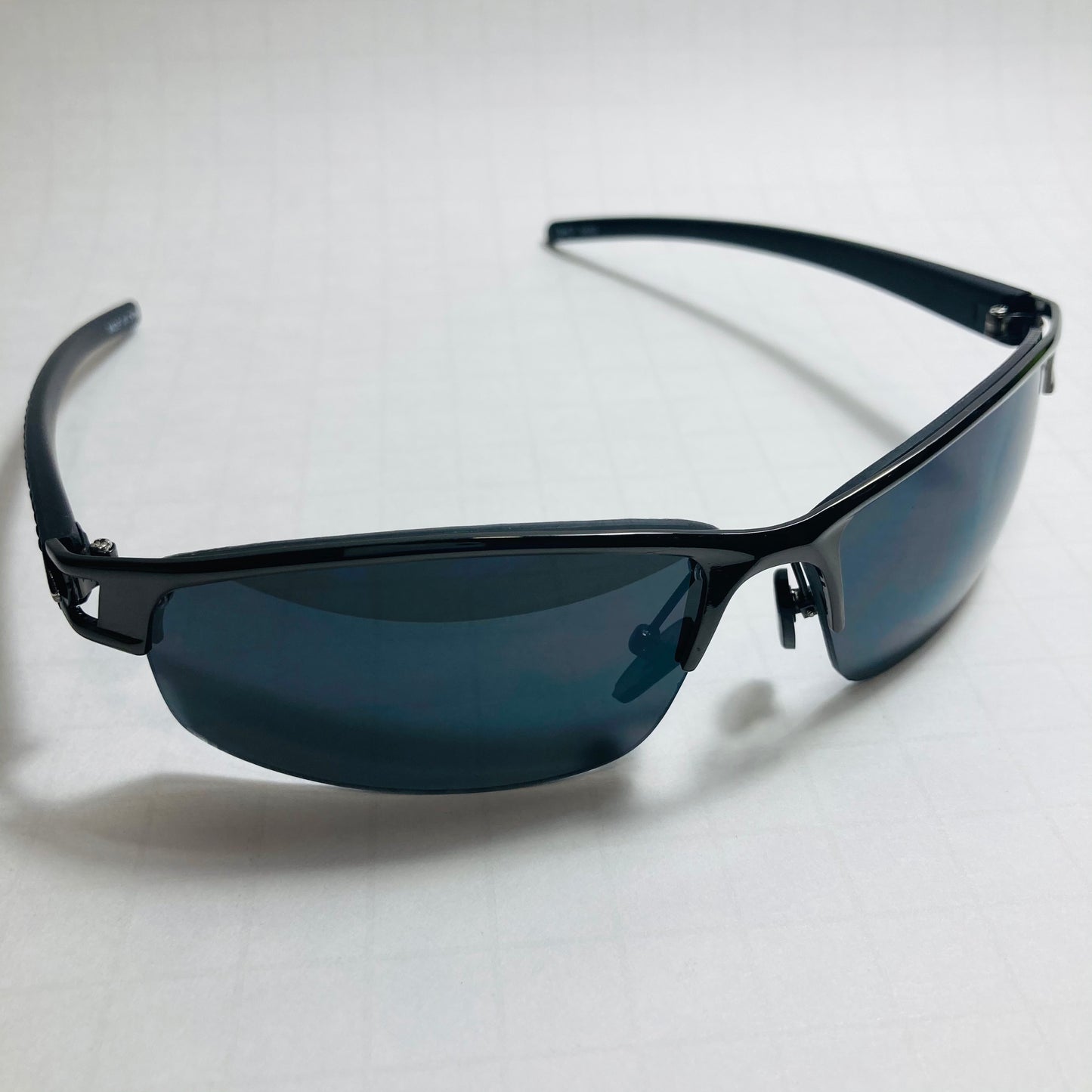 womens and mens black wrap around sunglasses with black lenses