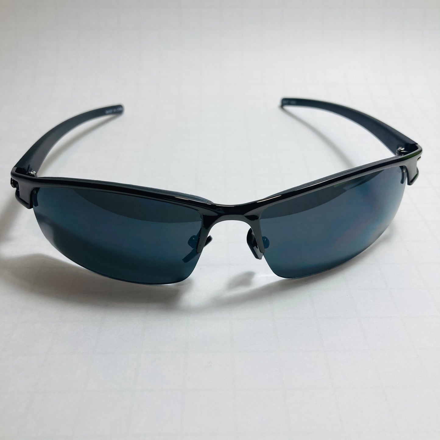 womens and mens black wrap around sunglasses with black lenses