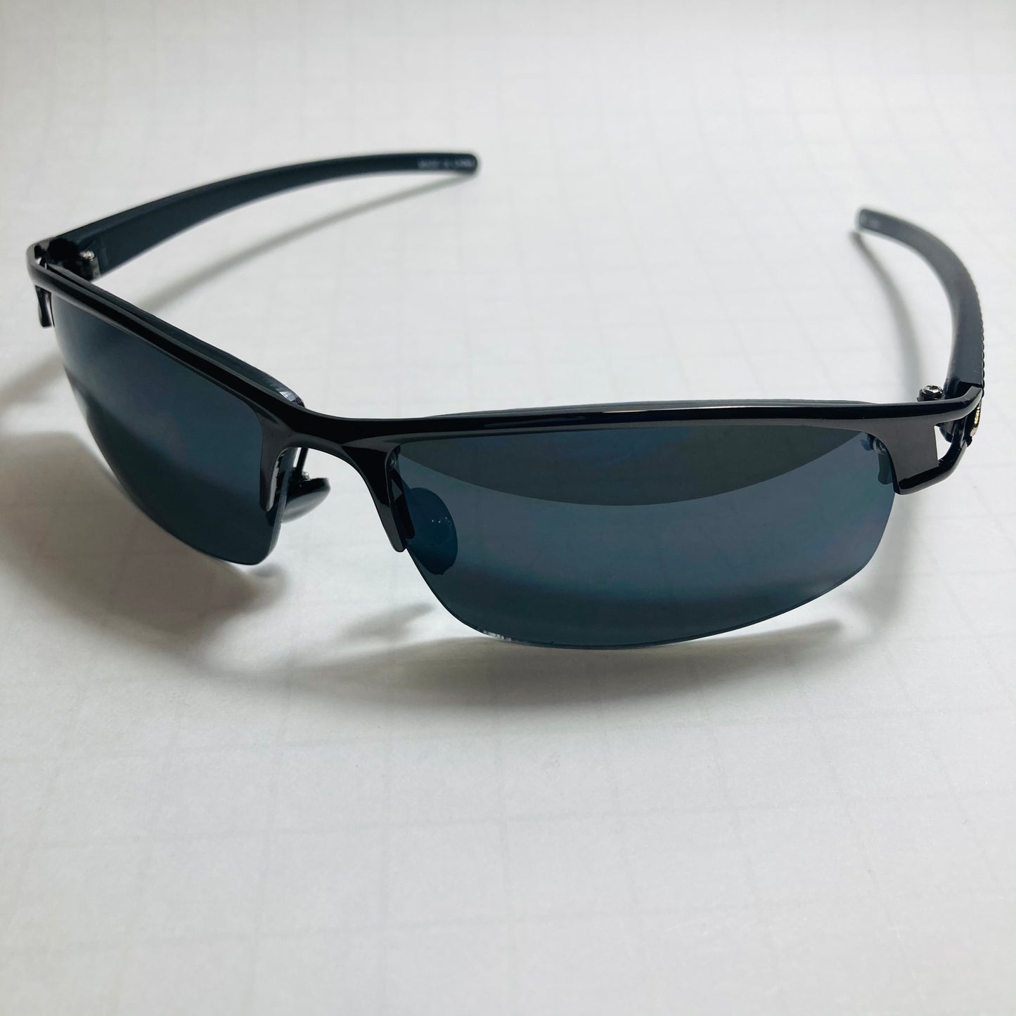 womens and mens black wrap around sunglasses with black lenses