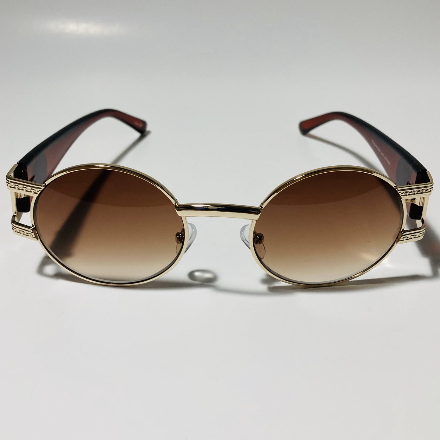mens and womens brown and gold round sunglasses