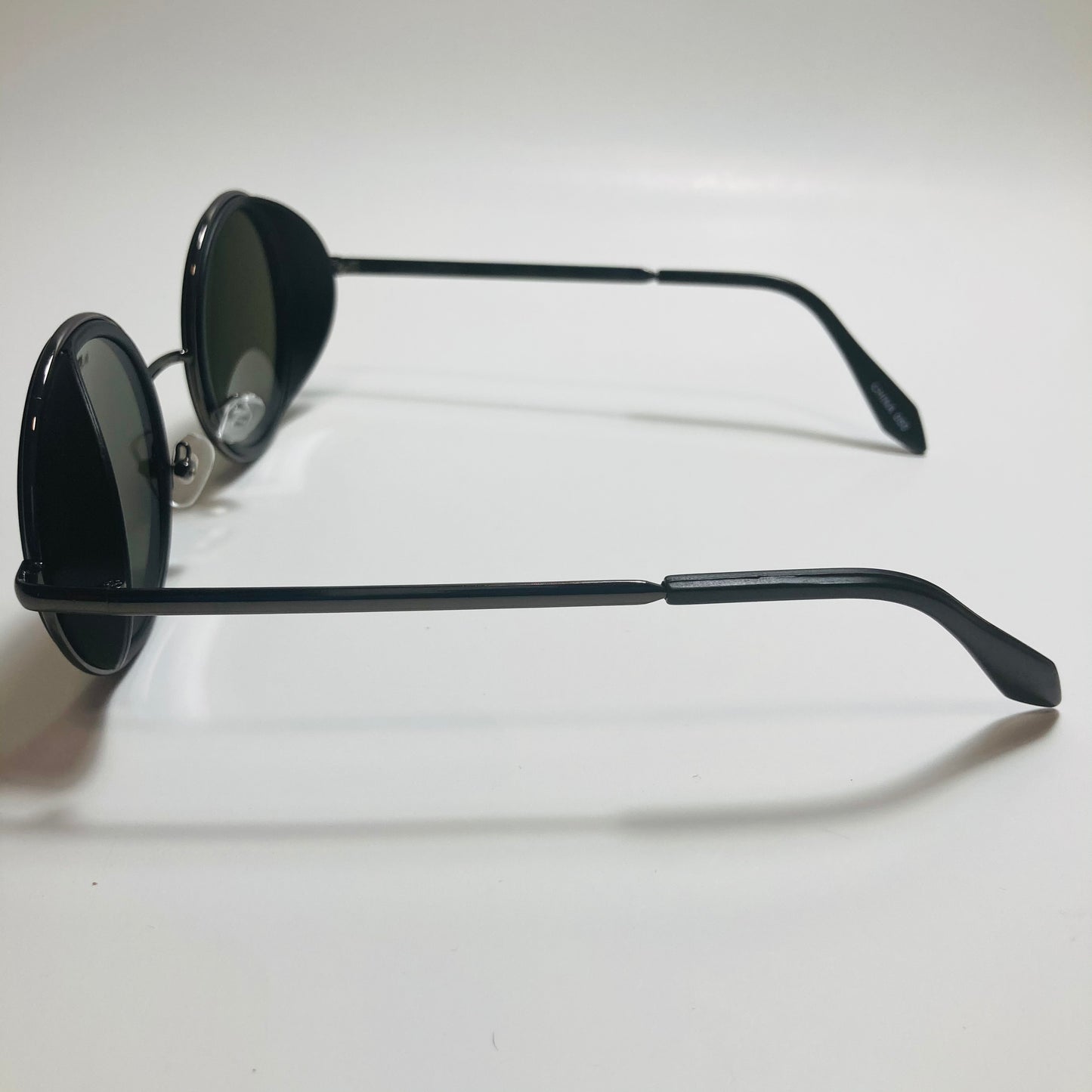 mens and womens black and green round side shield sunglasses