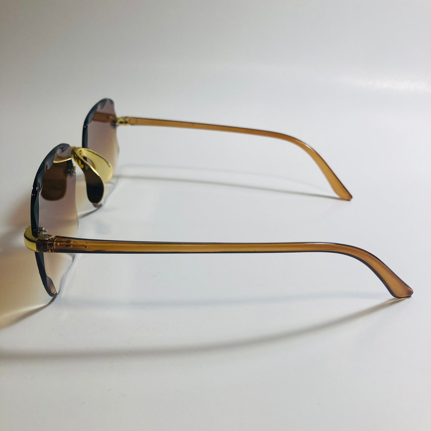 womens rimless gold square oversize sunglasses with brown lenses