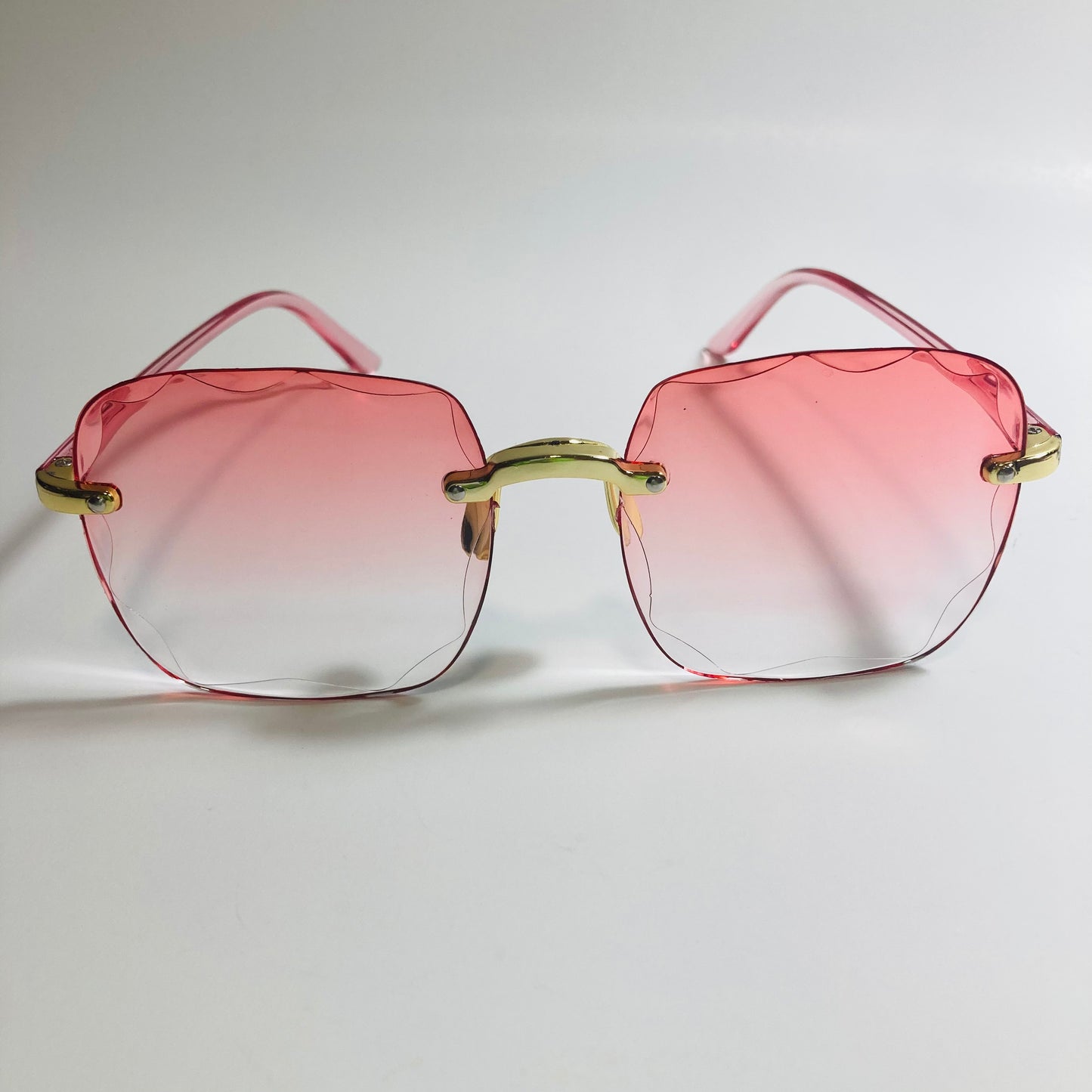 womens rimless gold square oversize sunglasses with pink lenses