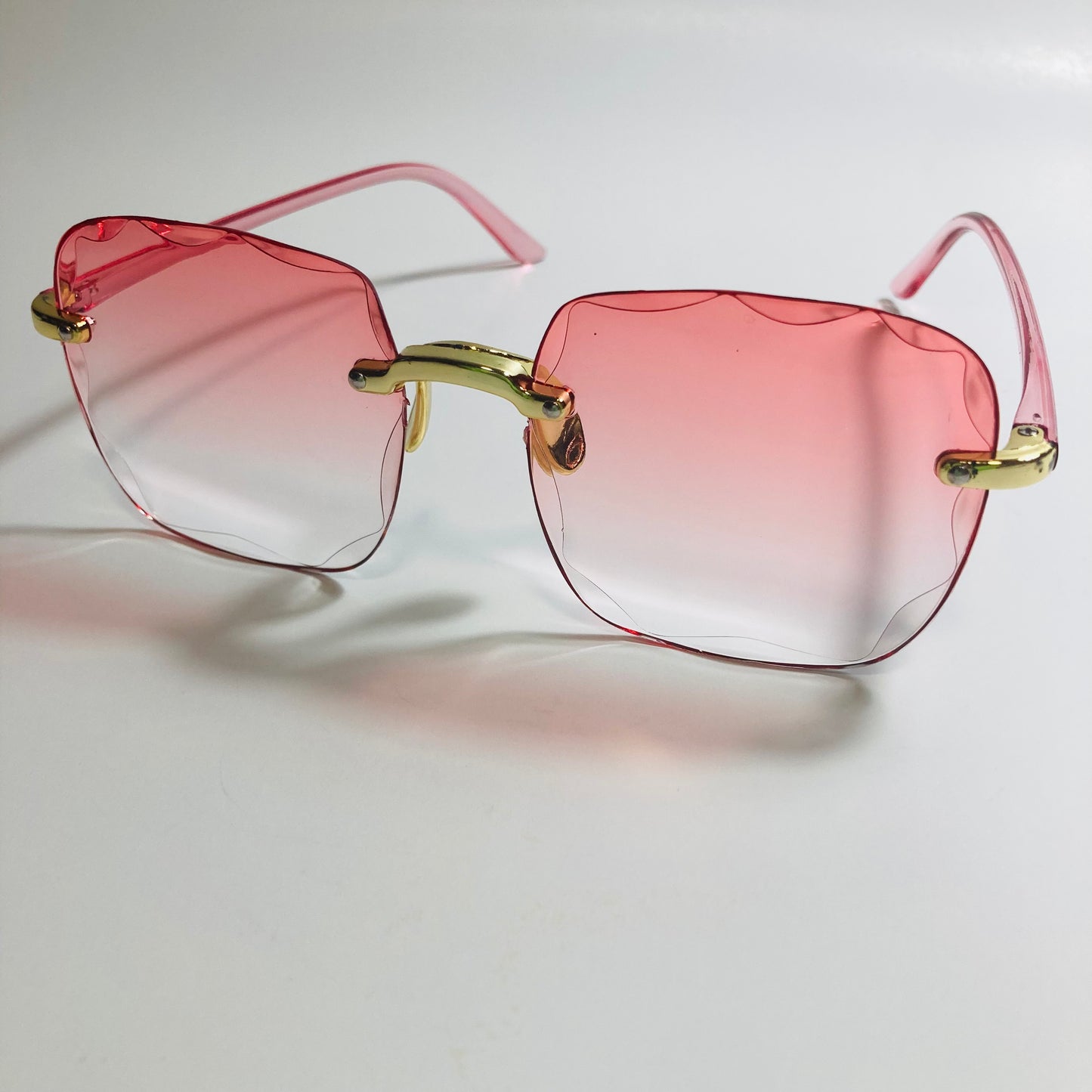 womens rimless gold square oversize sunglasses with pink lenses