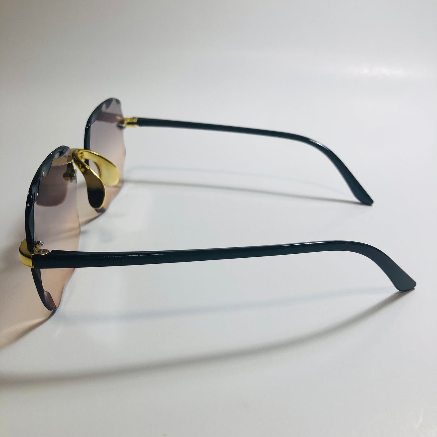 womens rimless gold square oversize sunglasses with black and brown lenses