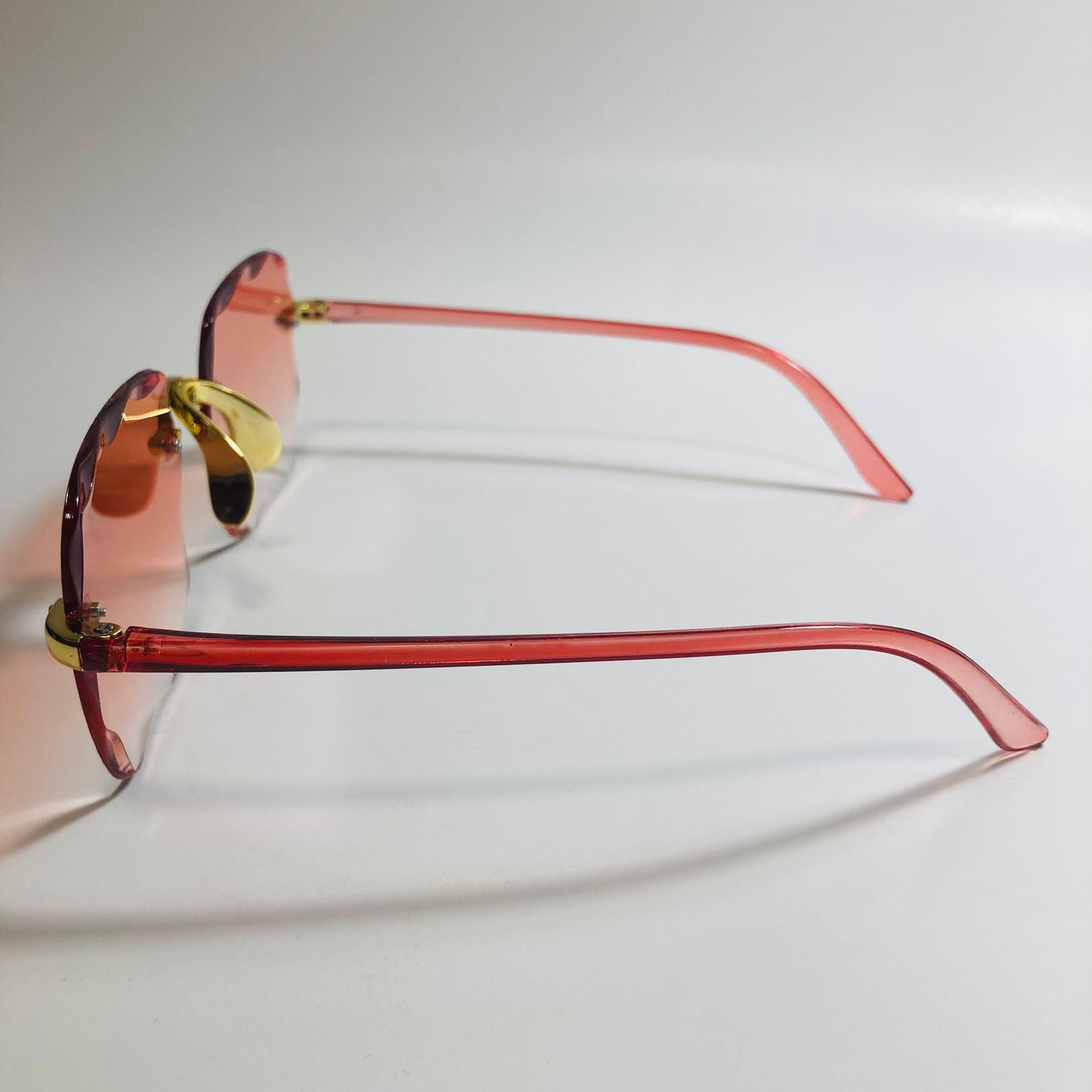 womens rimless gold square oversize sunglasses with red lenses