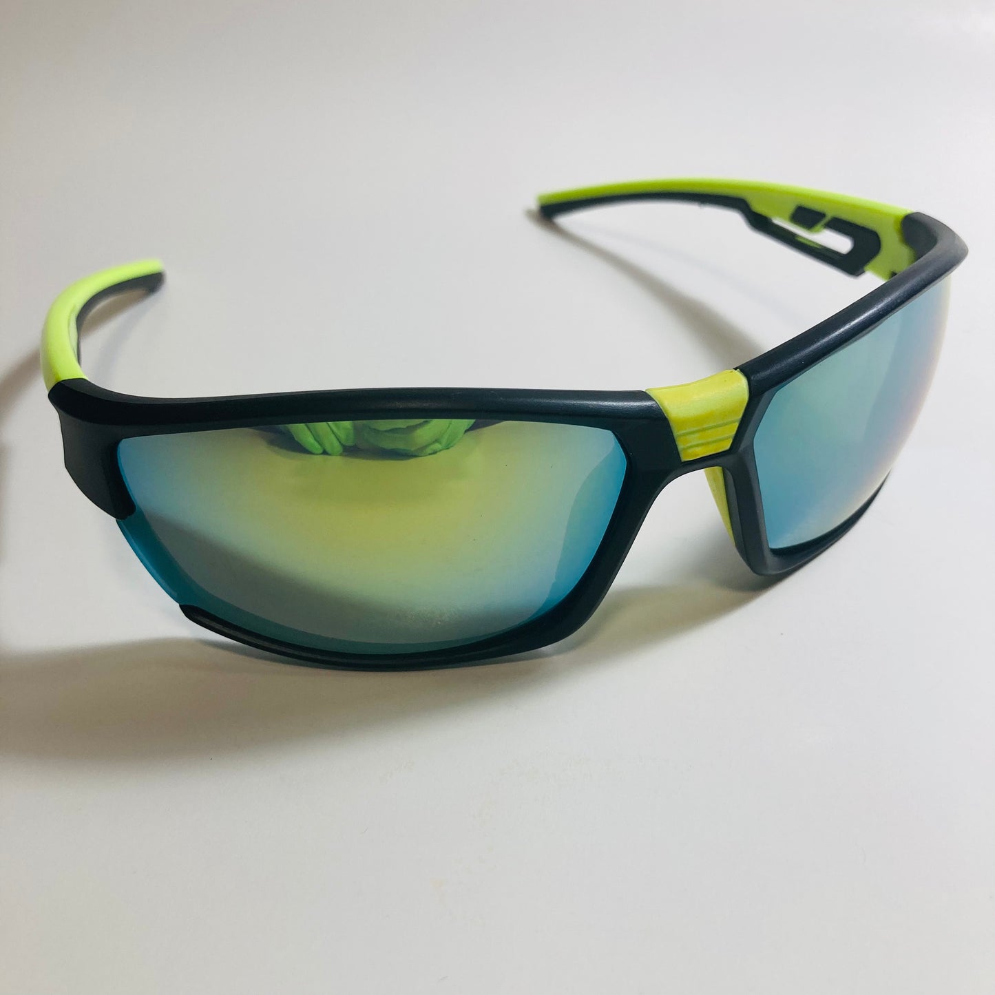 black, green, and yellow wrap around sunglasses
