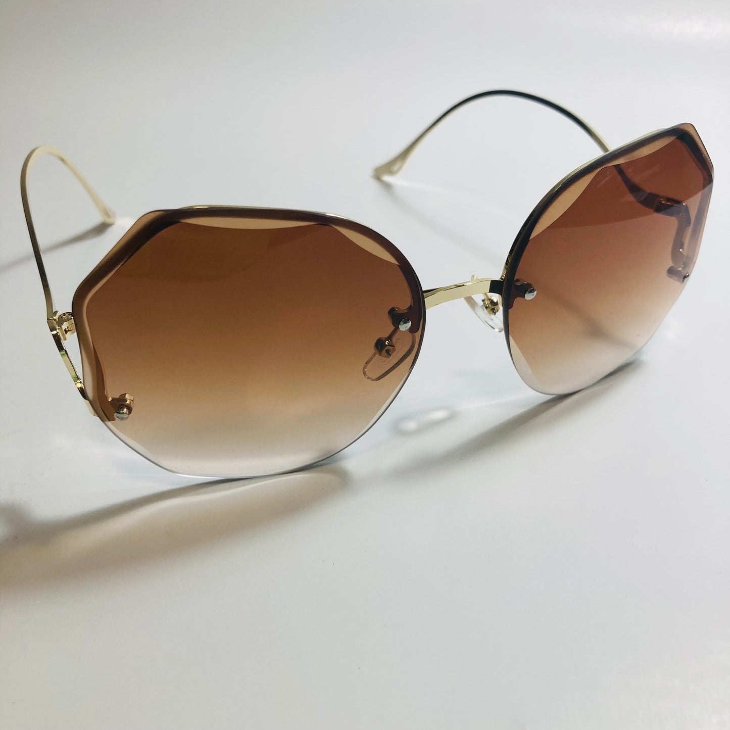 womens brown and gold rimless sunglasses
