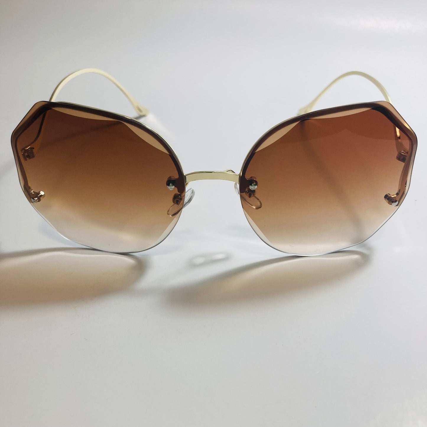 womens brown and gold rimless sunglasses