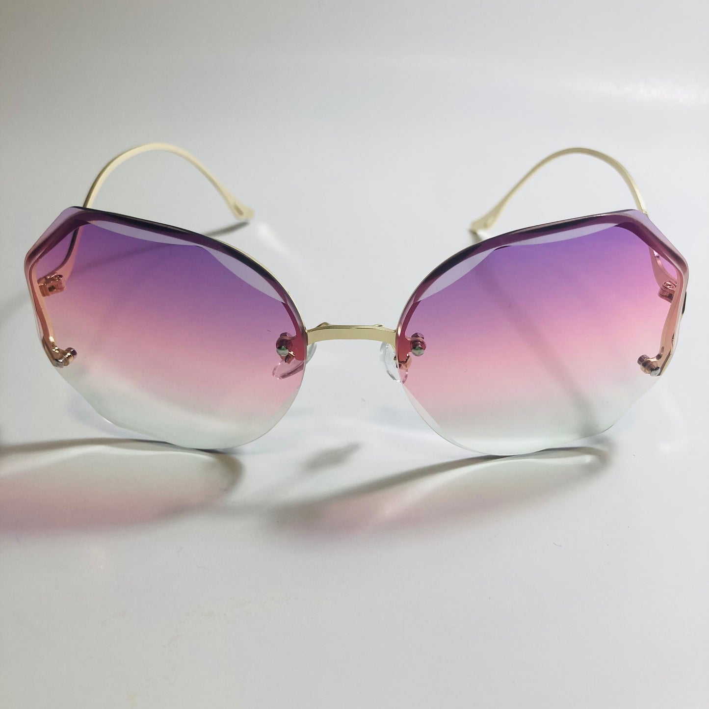 womens pink purple and gold rimless sunglasses