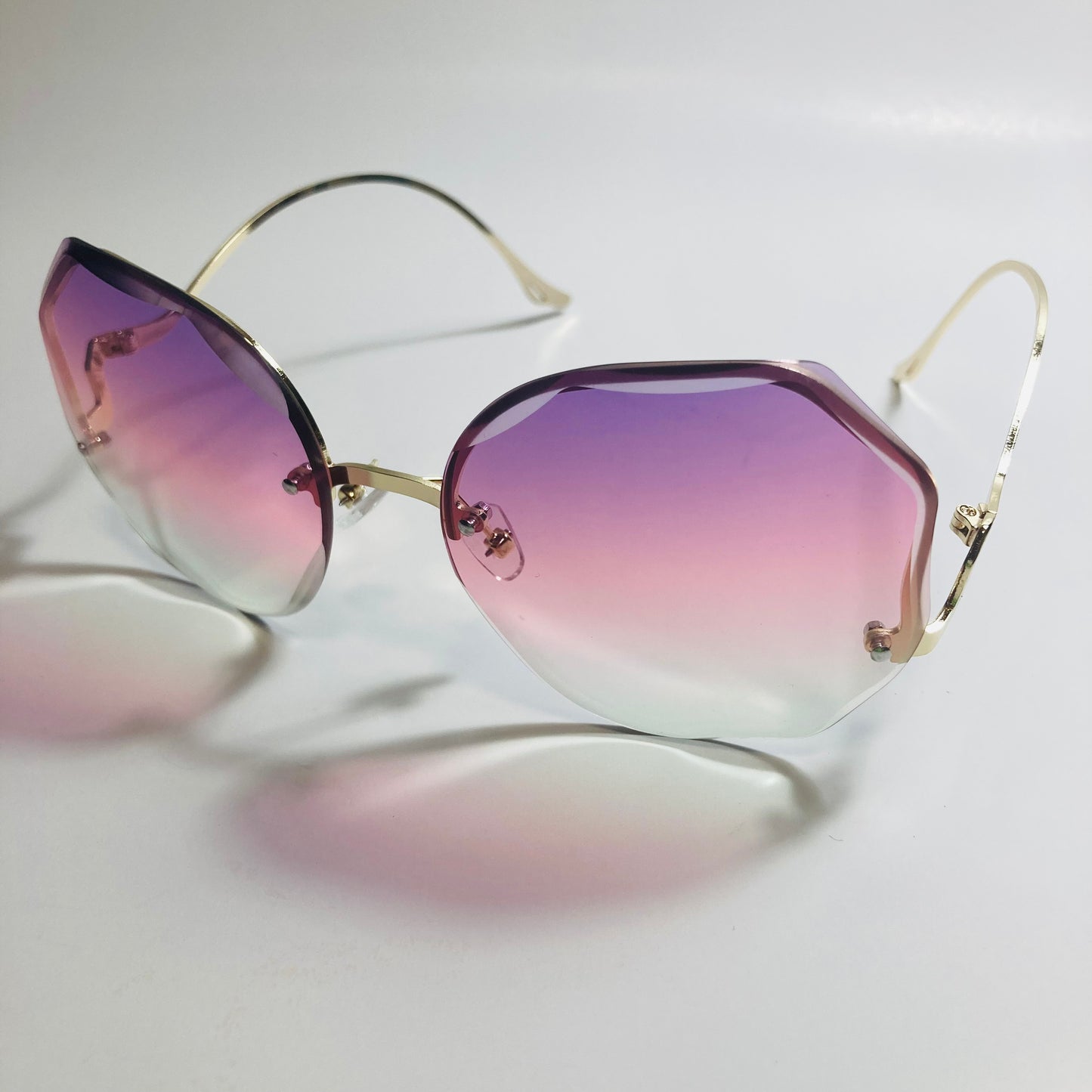 womens pink purple and gold rimless sunglasses