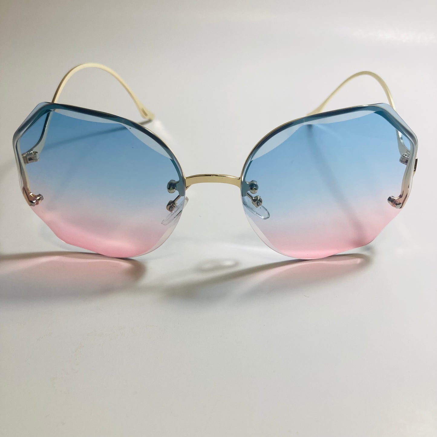 womens pink blue and gold rimless sunglasses