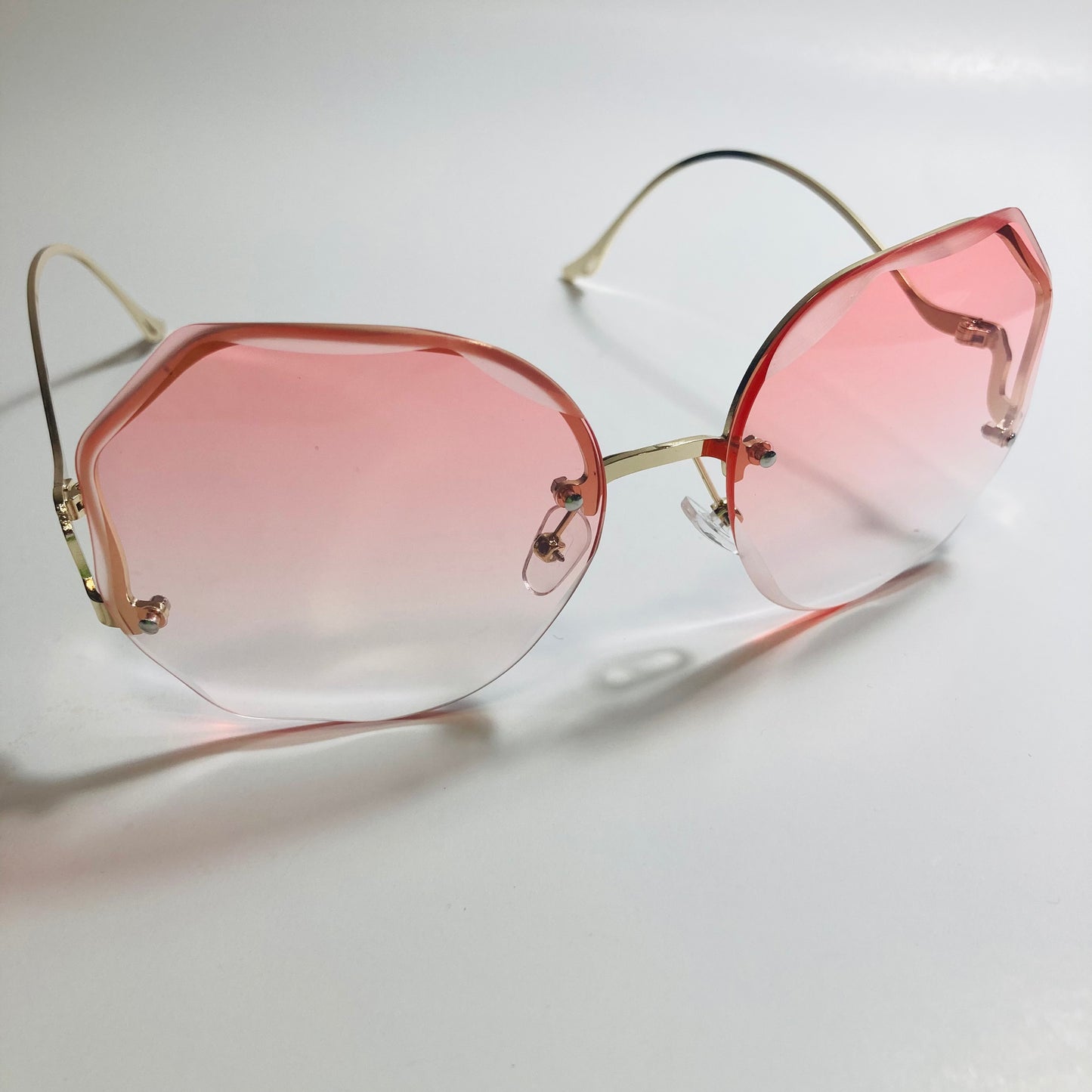 womens pink and gold rimless sunglasses