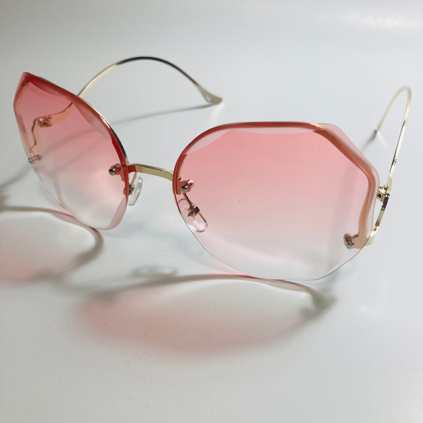 womens pink and gold rimless sunglasses