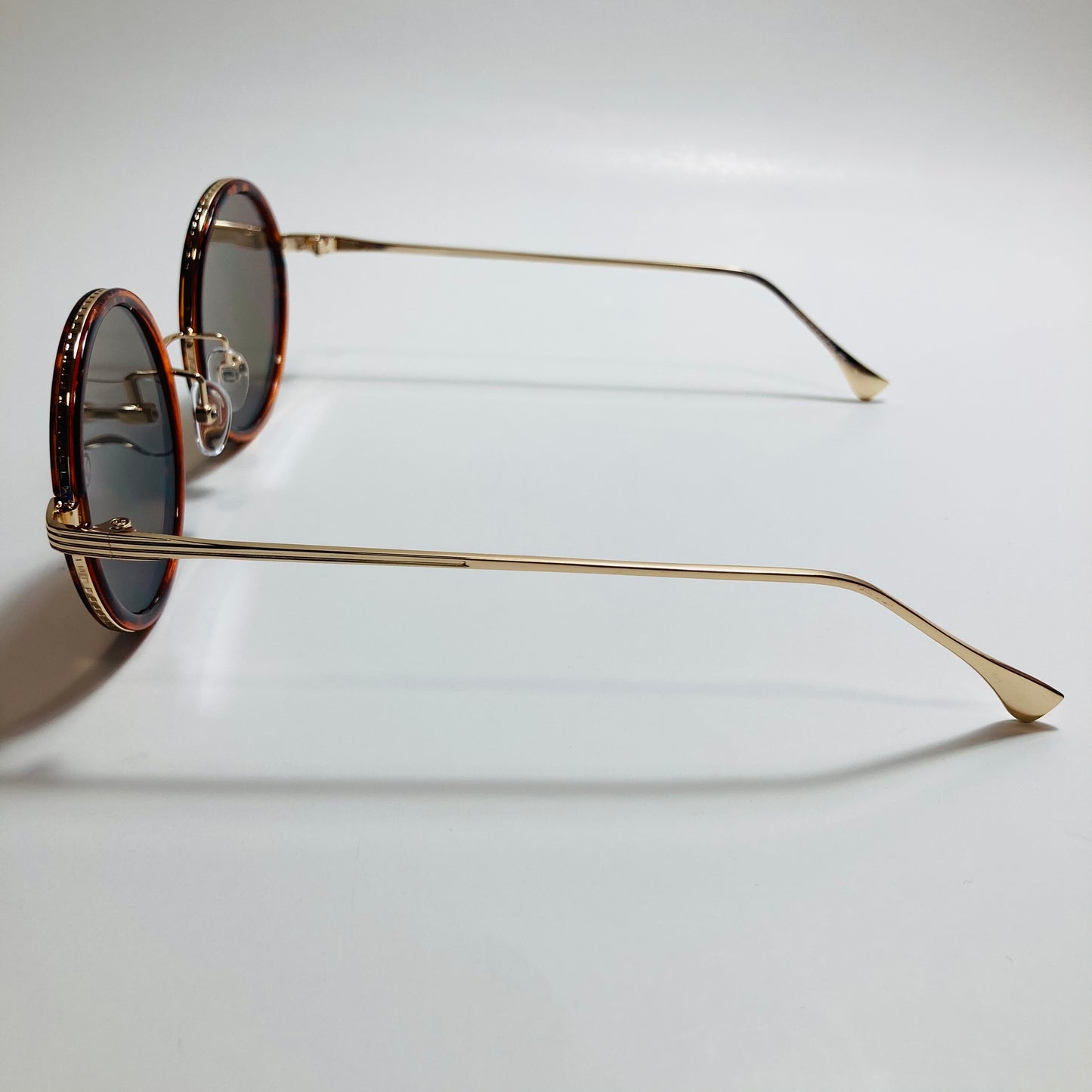 gold and blue womens round sunglasses with mirror lenses