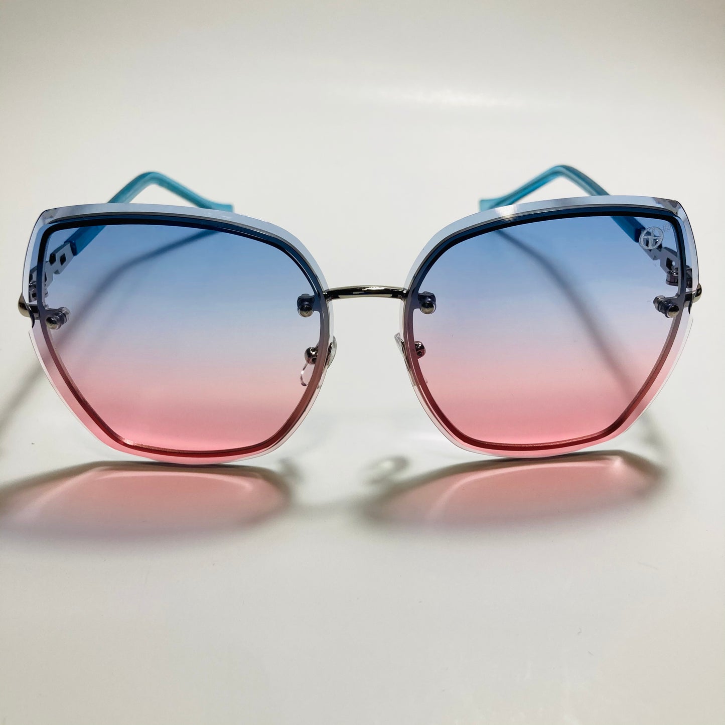 womens blue and pink rimless oversize sunglasses