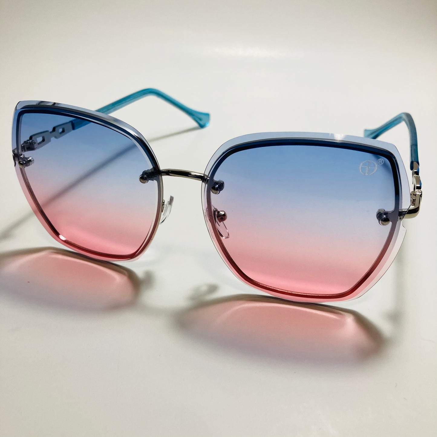 womens blue and pink rimless oversize sunglasses