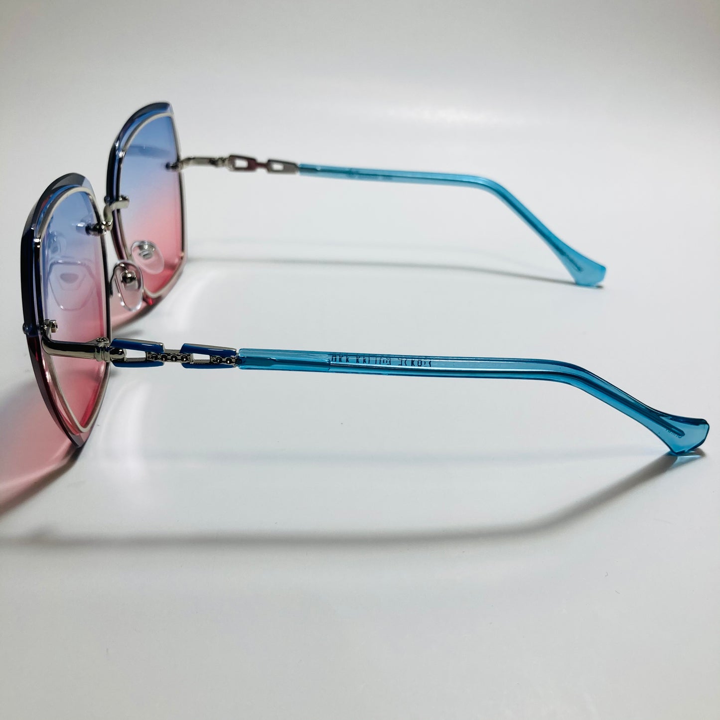 womens blue and pink rimless oversize sunglasses