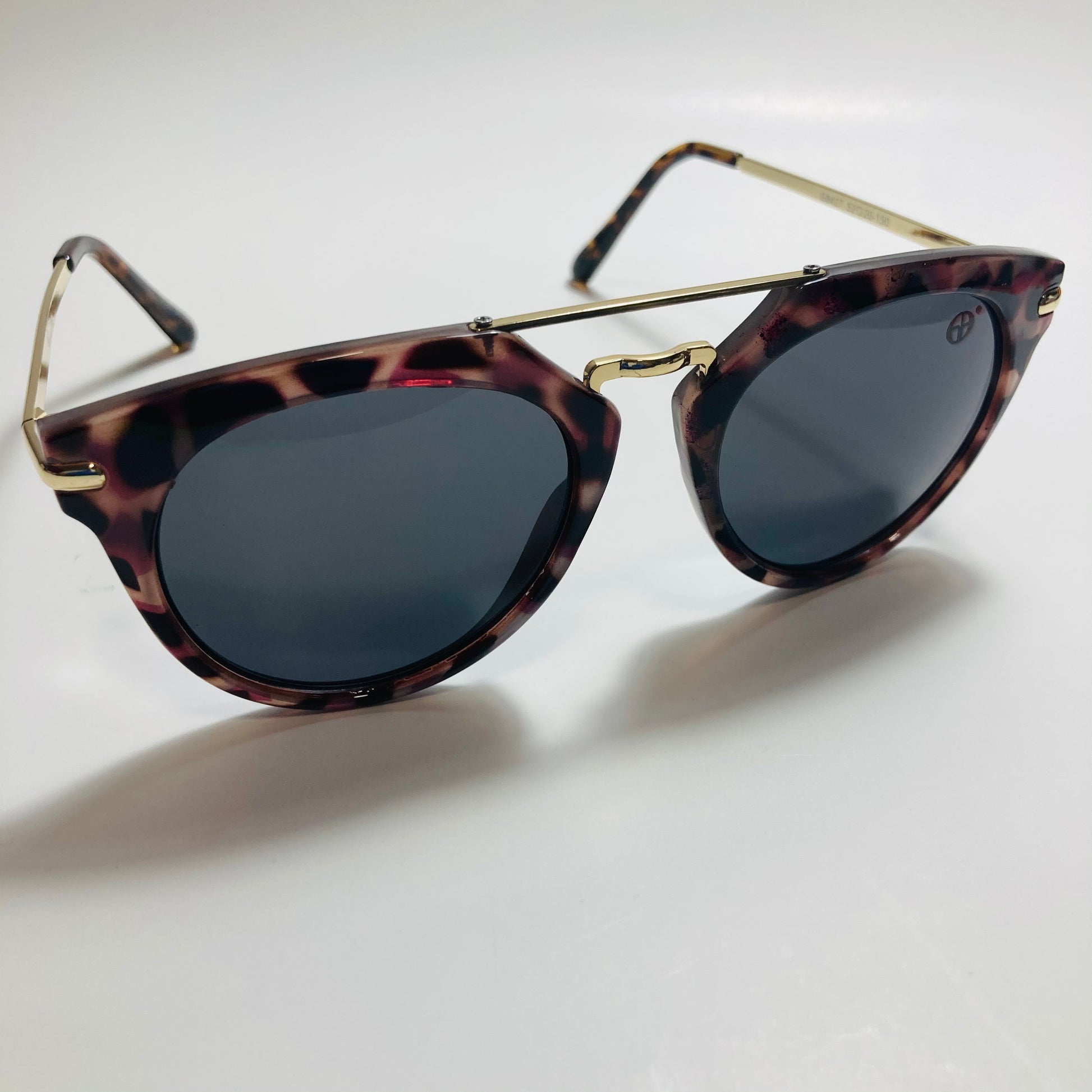 mens and womens black gold and brown mirrored round sunglasses with crossbar