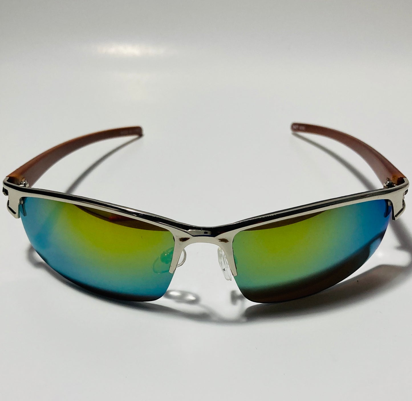 womens and mens silver wrap around sunglasses with mirrored green lenses