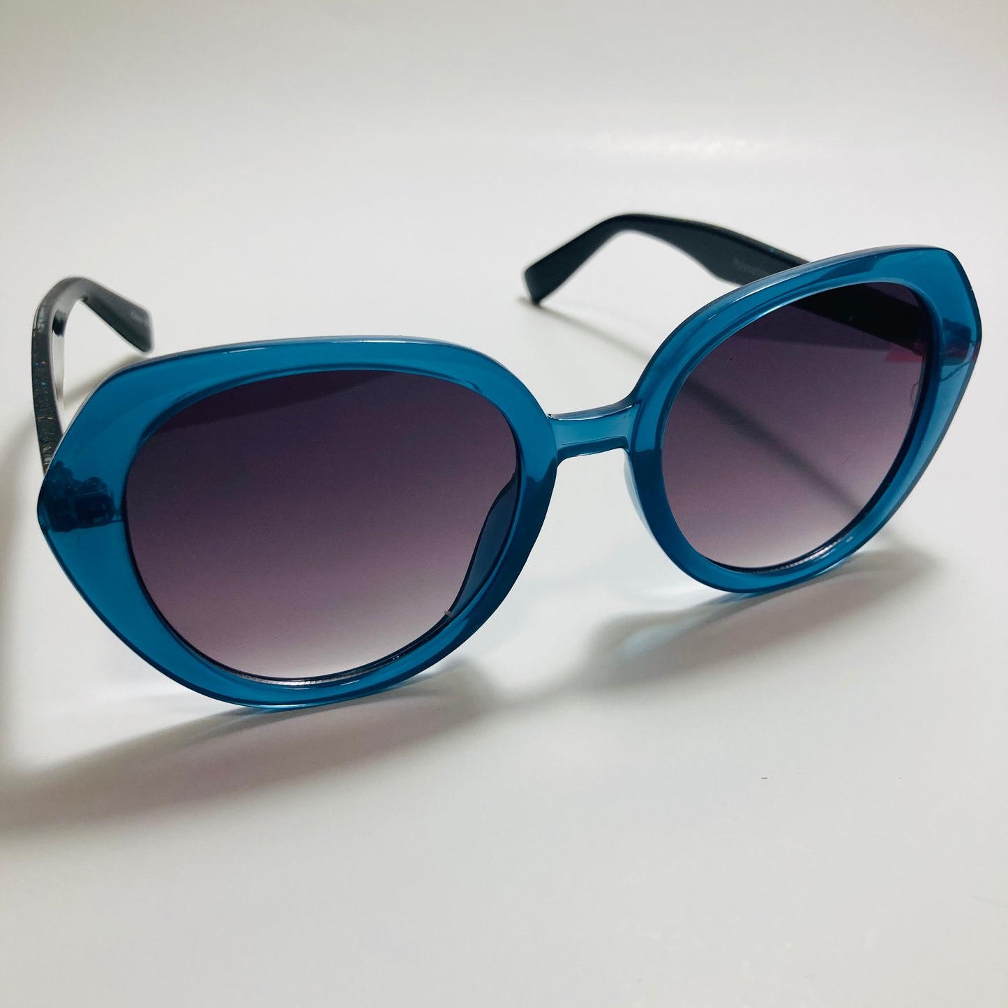 womens black and blue round glitter sunglasses