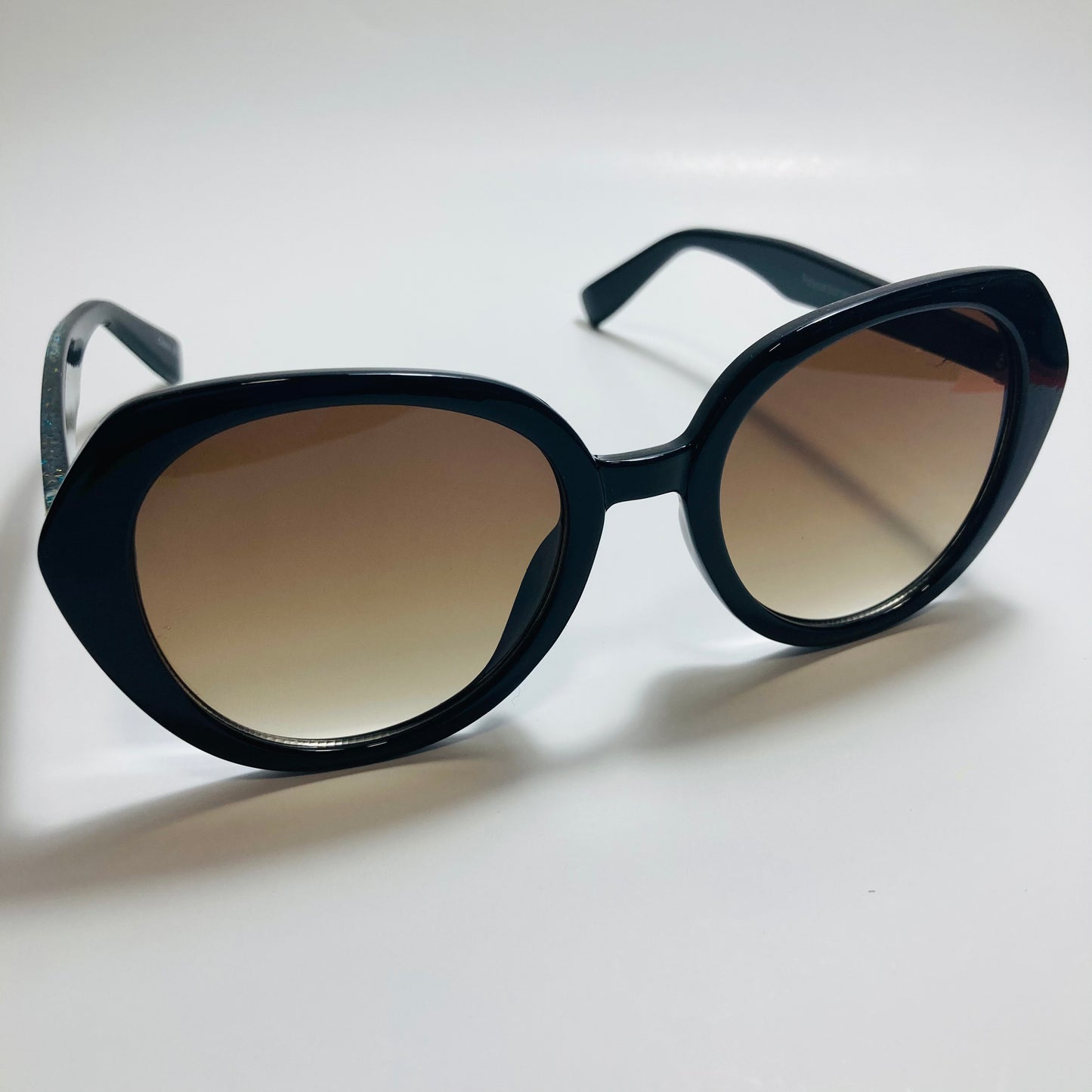 womens black and brown round glitter sunglasses