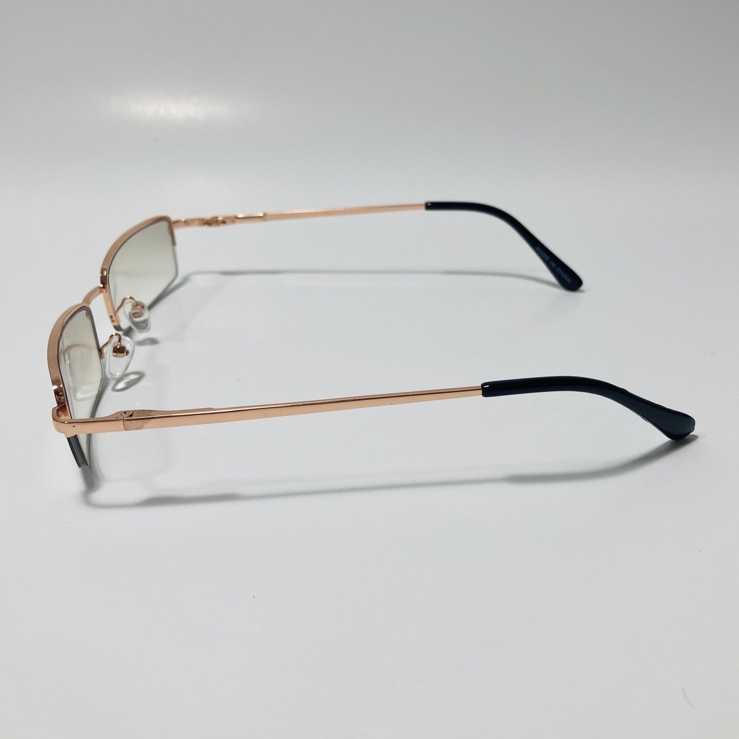 womens and mens clear and gold metal square sunglasses