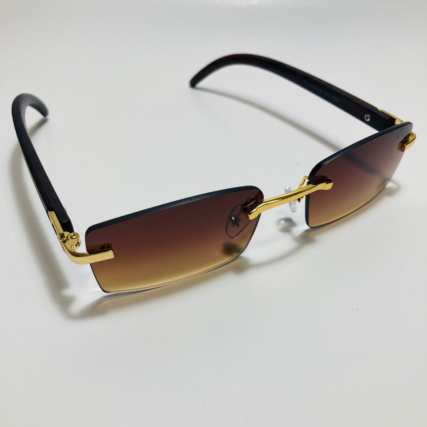 mens and womens brown and gold rimless square sunglasses