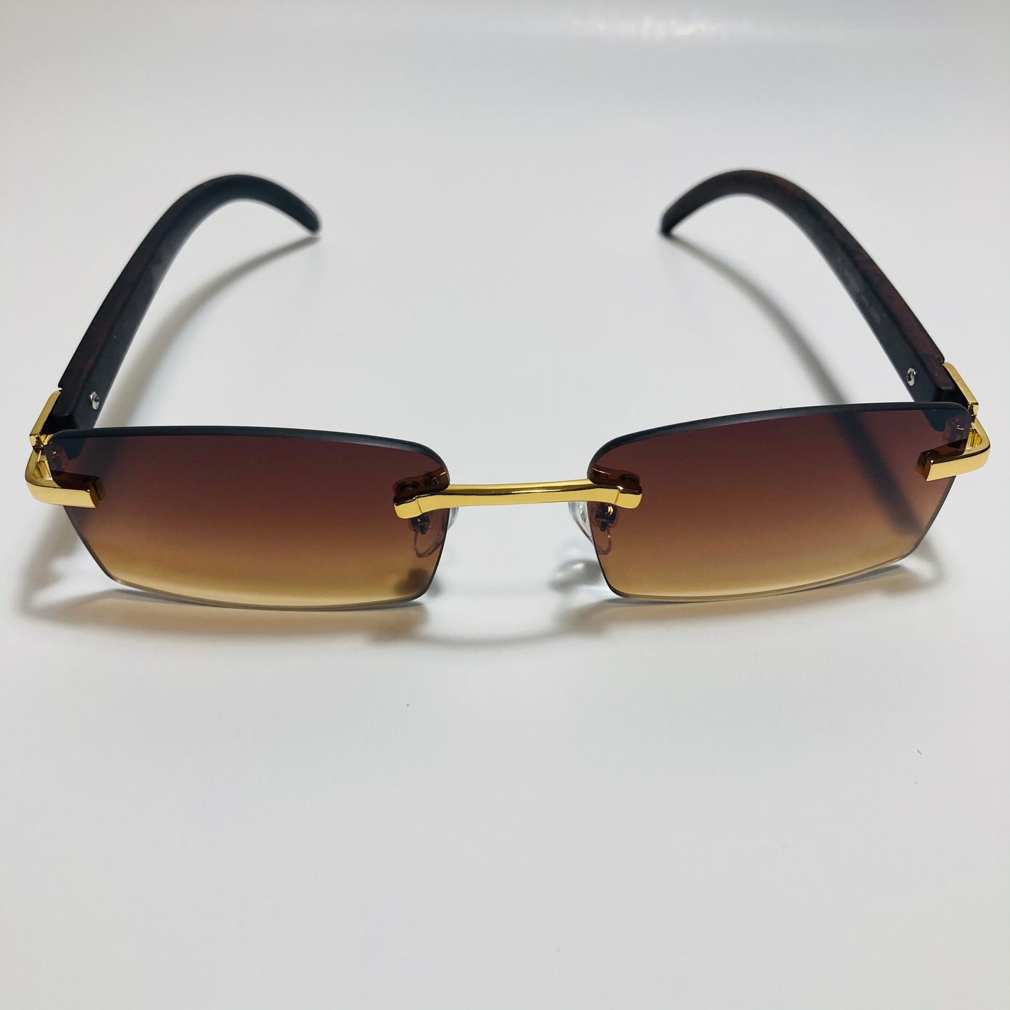 mens and womens brown and gold rimless square sunglasses